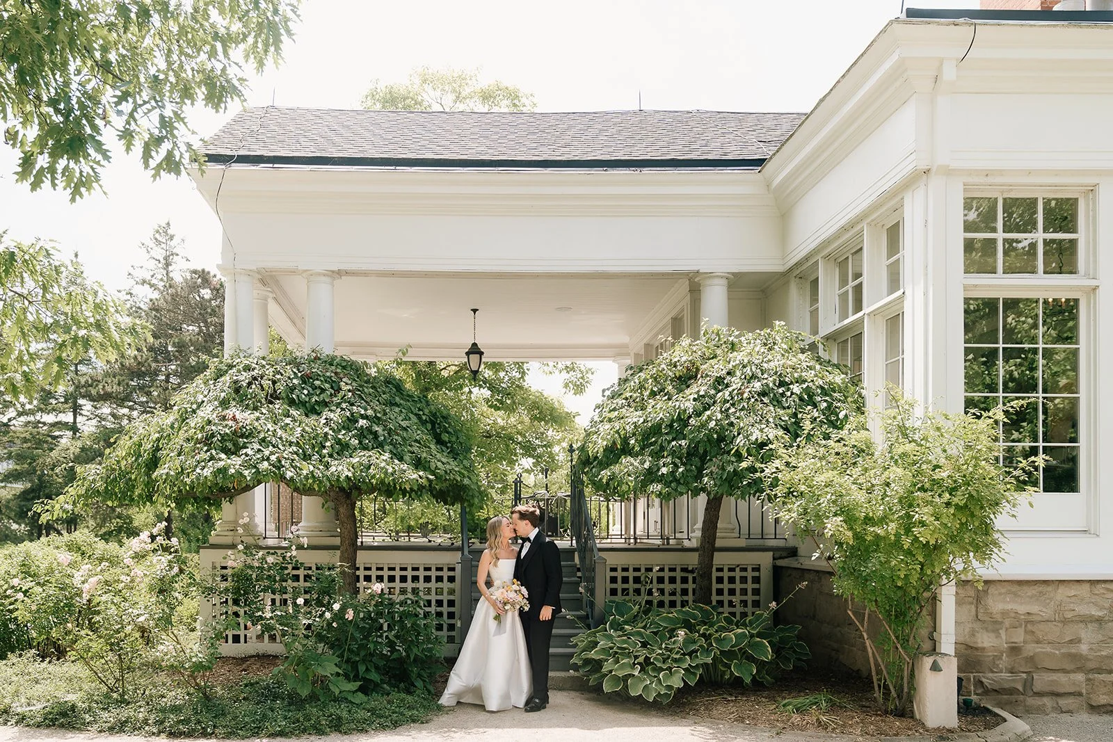couple standing outside cambridge wedding venue langdon hall