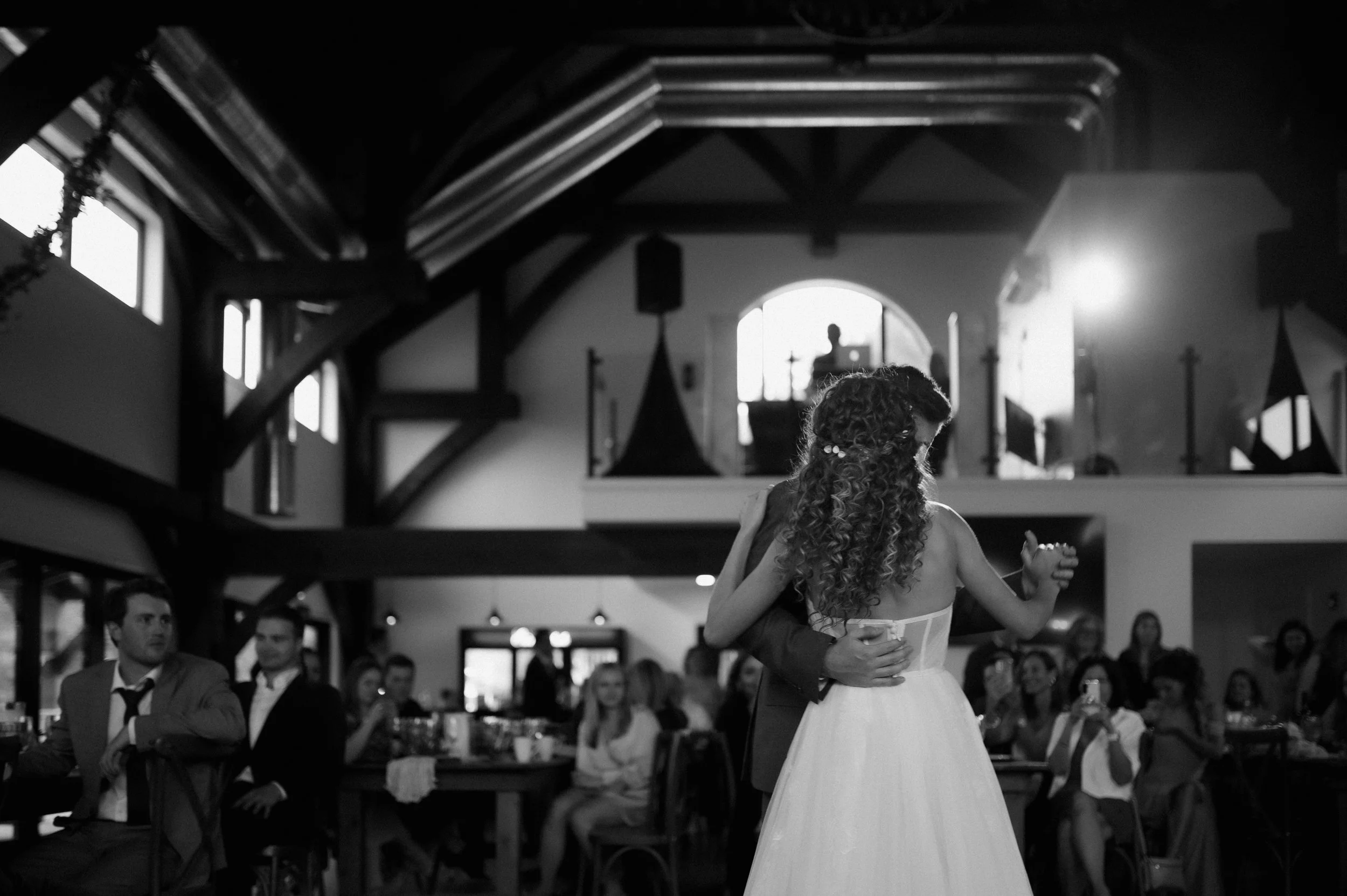 black and white photo of bride and groom dancing at wedding reception with intune wedding DJs