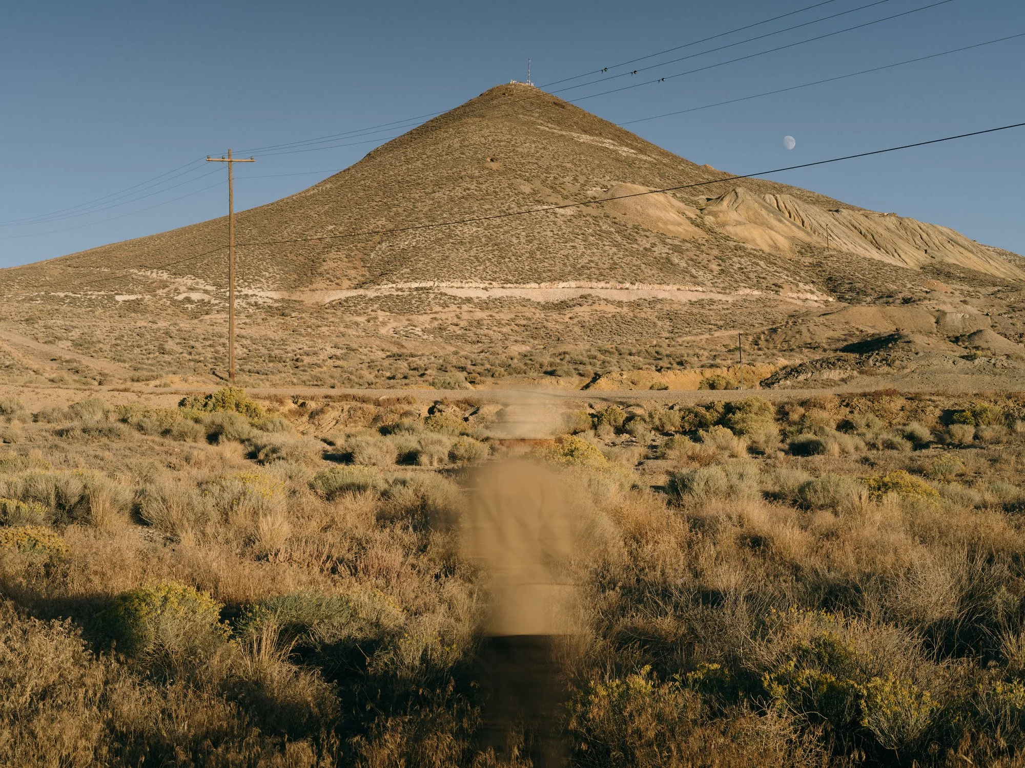 Color photograph by Beihua Guo documenting the site of the former Tonopah Chinatown. The landscape image explores historical erasure, referencing the September 1903 union-led mob attack that destroyed homes and forced residents into the desert.