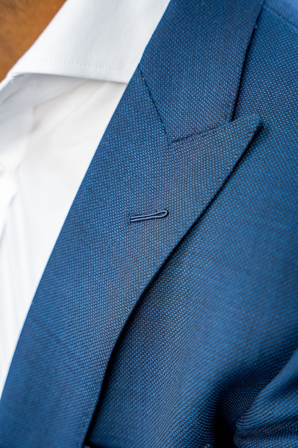 hand-stitched lapel buttonhole