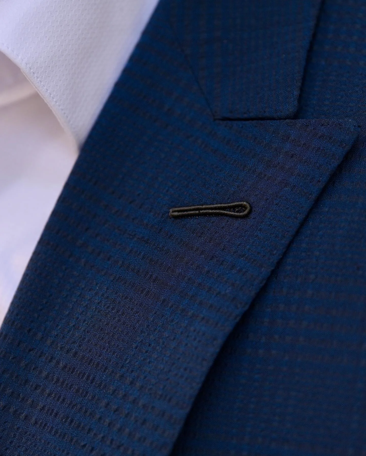 hand-stitched lapel buttonhole
