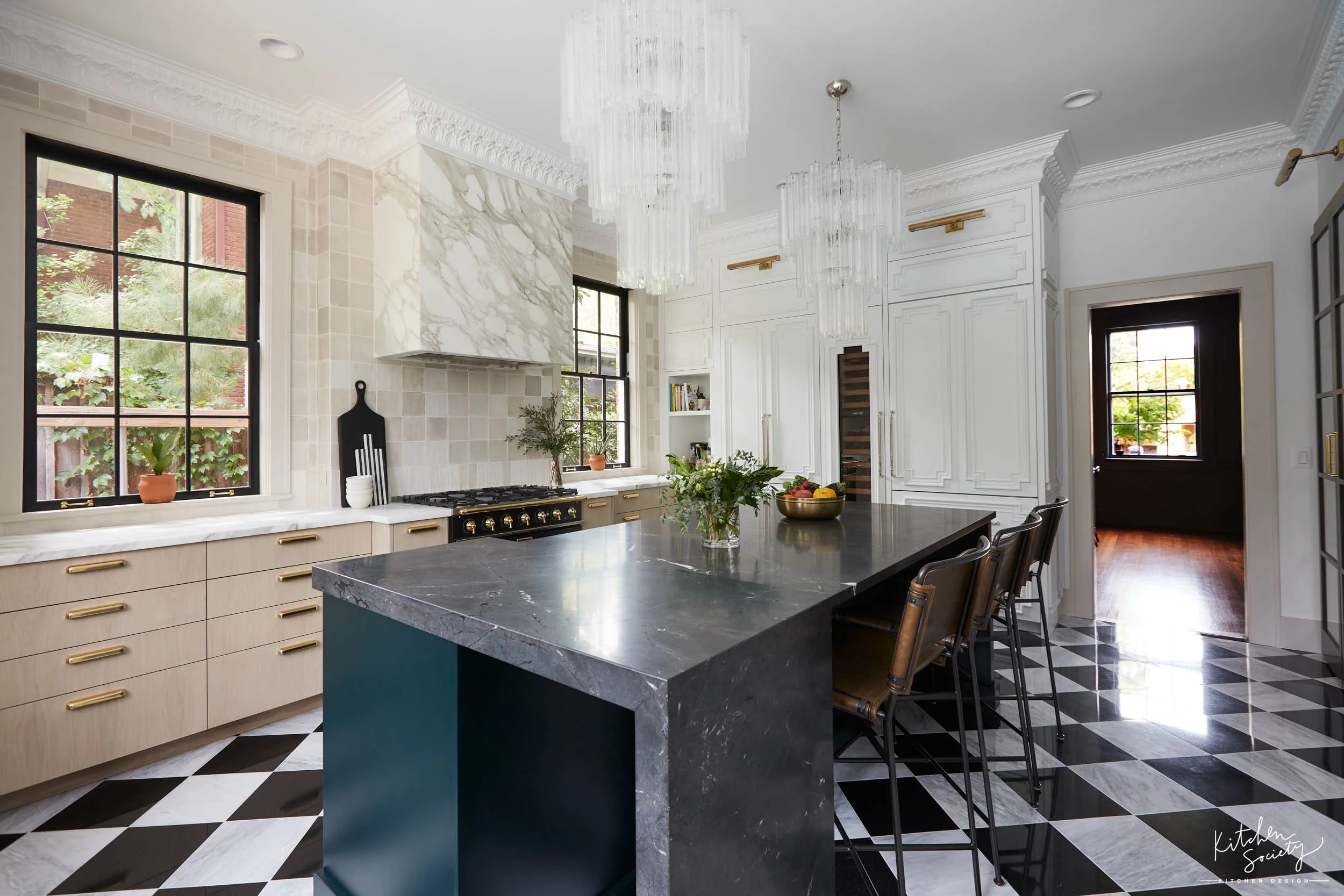  Custom tile floor with black and white kitchen countertops and other decor items.  