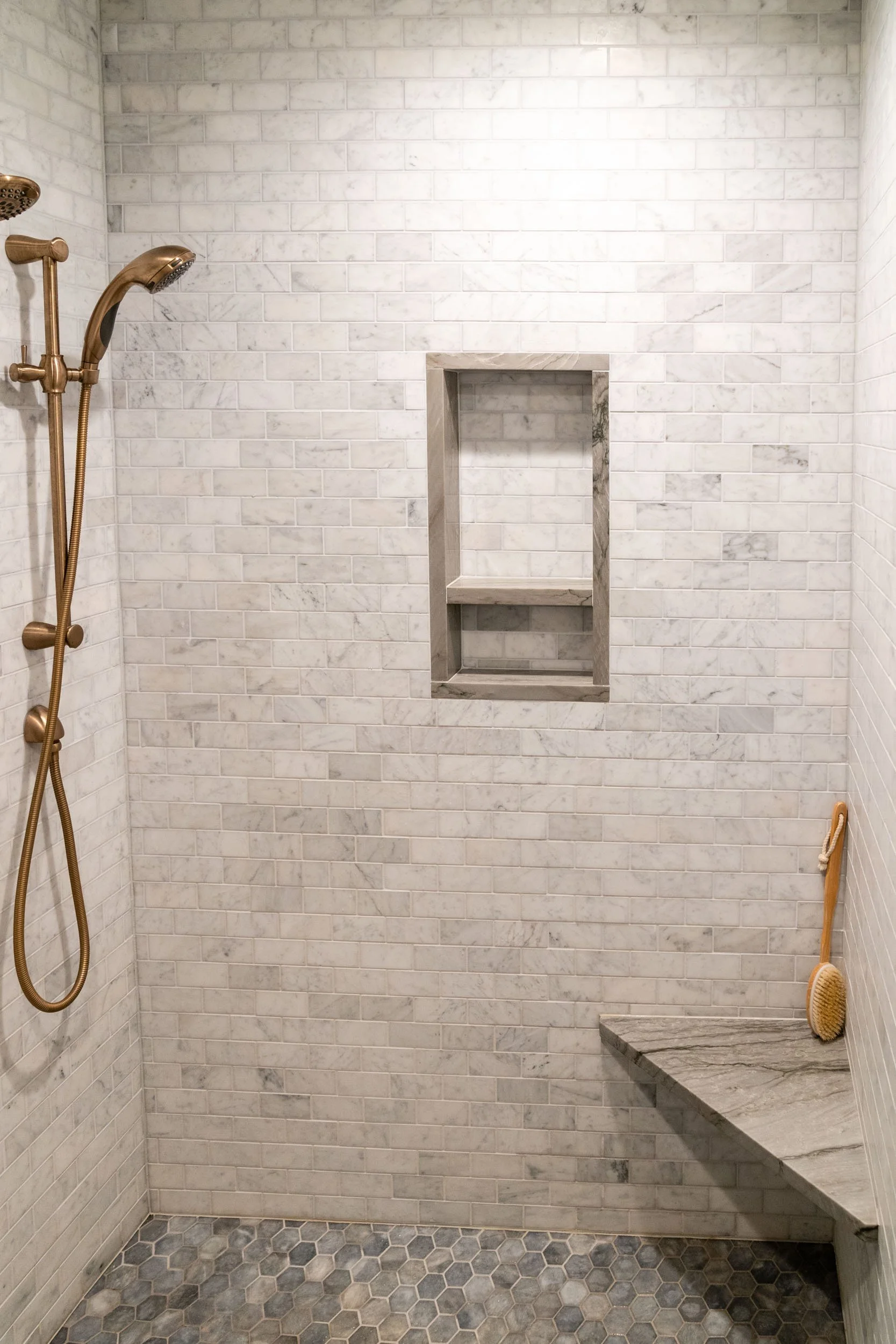  Custom tile by Young Brothers in OKC with brass shower accents.  