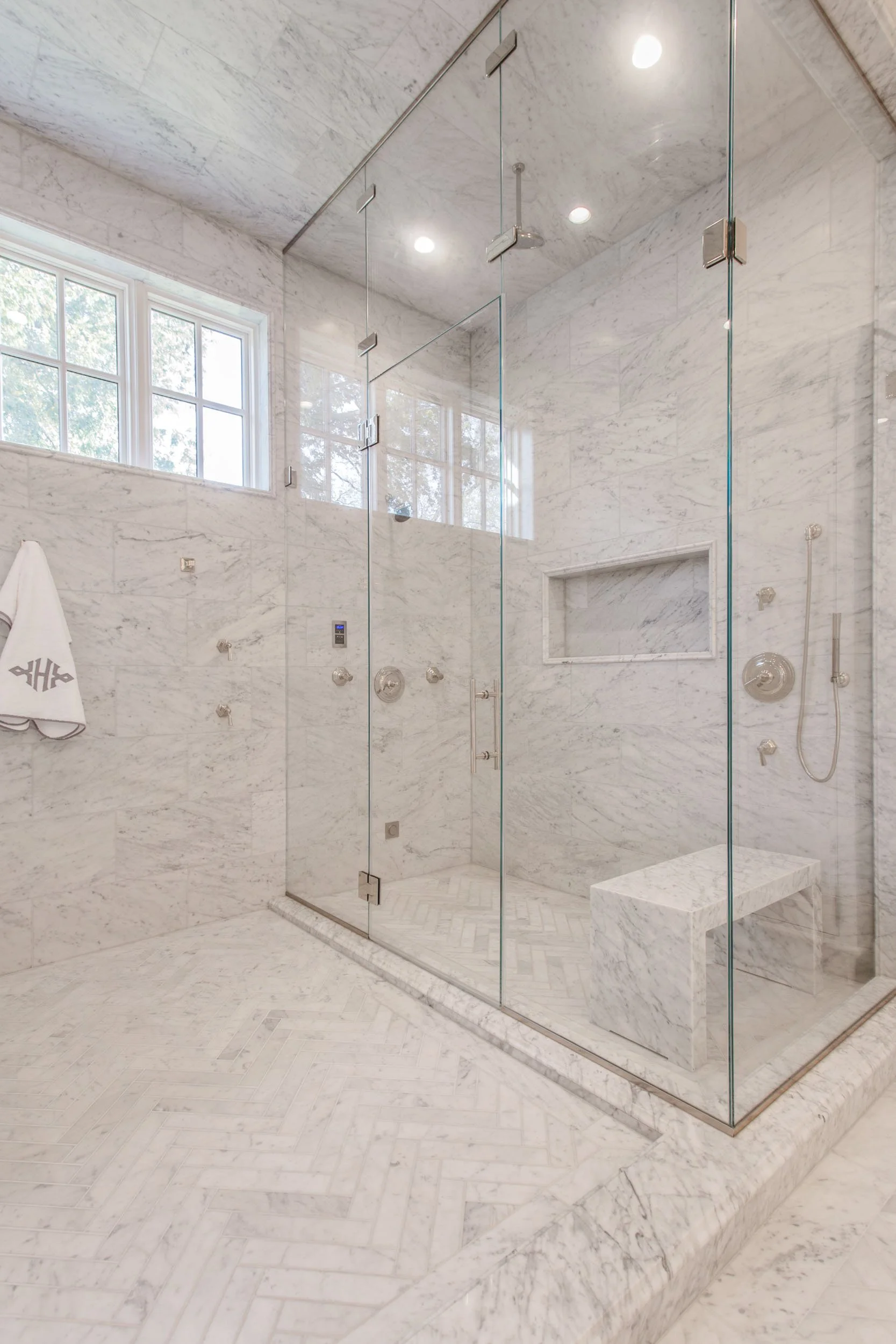  Custom tile in a shower with brushed nickel accents.  
