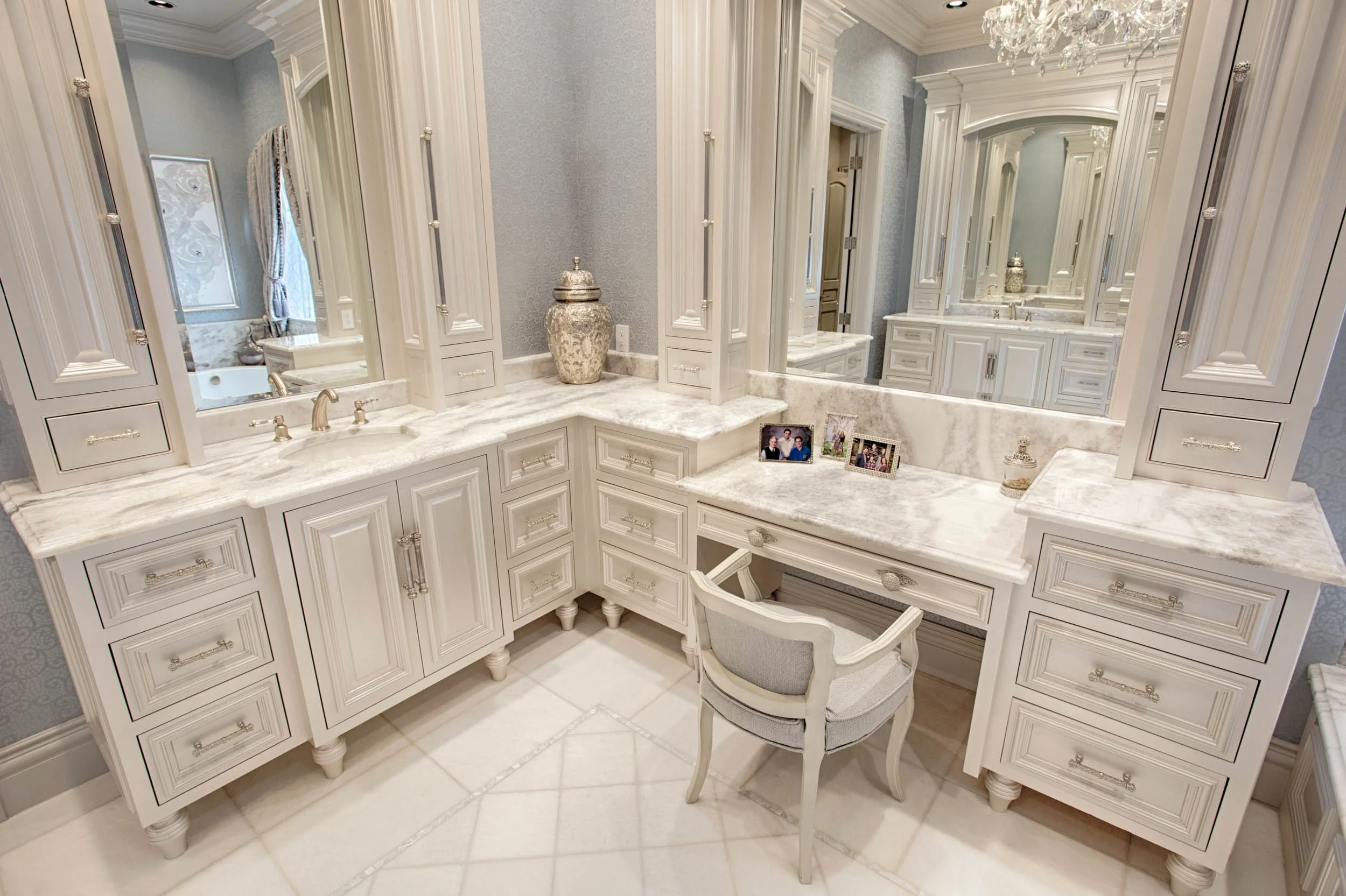 Bathroom countertops by Young Brothers with grey walls and white cabinetry.  