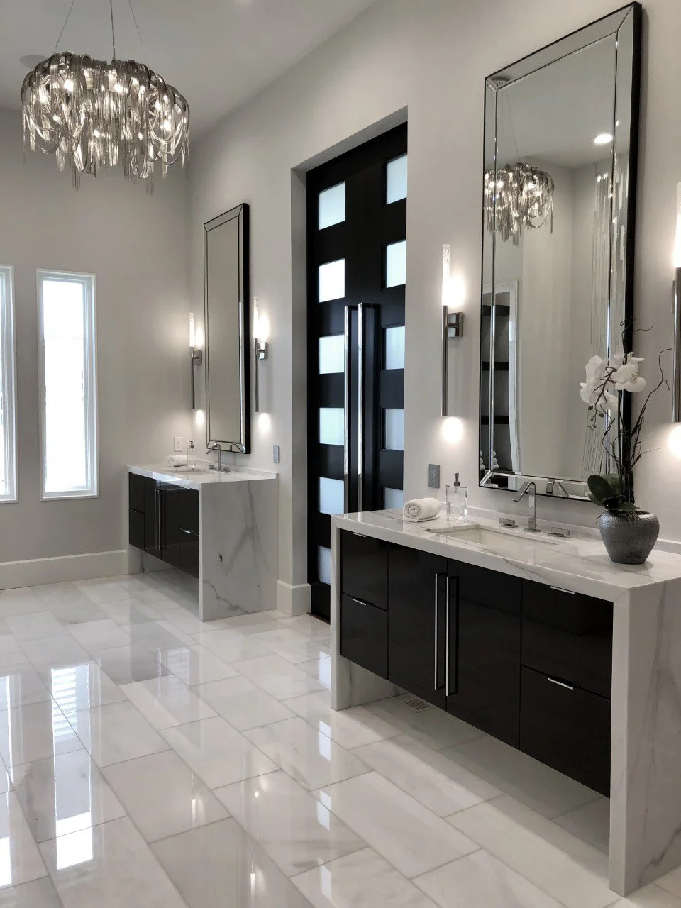  Bathroom countertops and floor tile with black accents.  