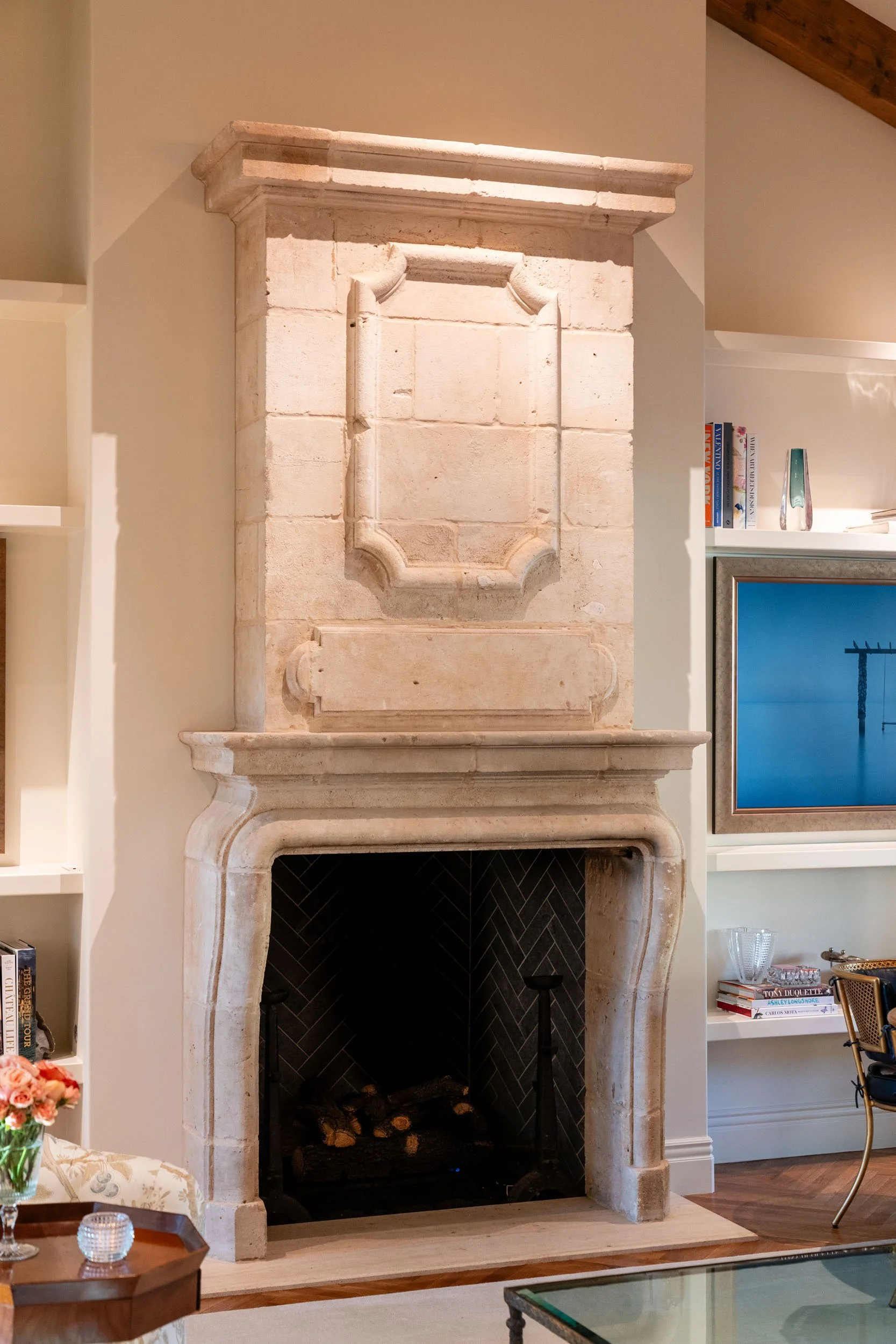  Stone fireplace installation with white walls.  