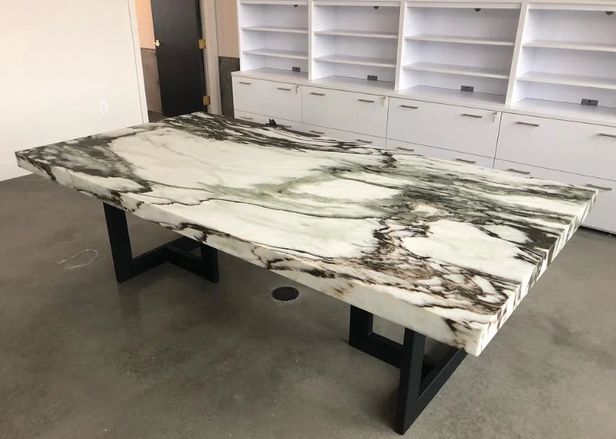  Custom marble tabletop with white cabinets.  