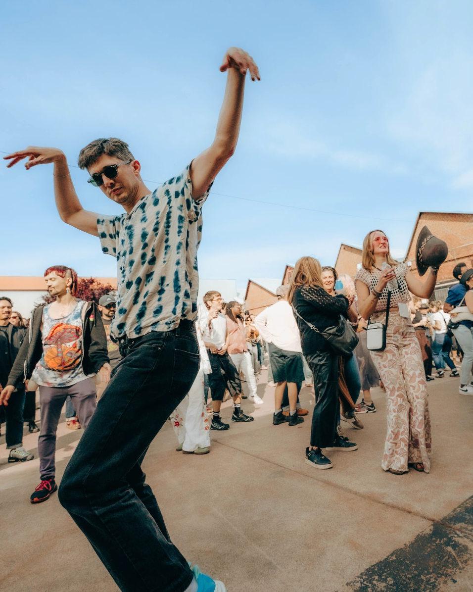 People dancing at an outdoor music event at The Loom Oakland