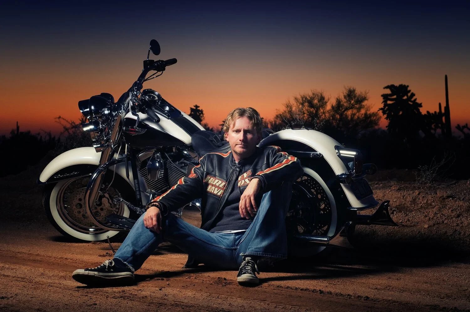 American singer-songwriter Scott Helmer with a Harley-Davidson motorcycle in the official promotional photo for the single "Long Way Round."