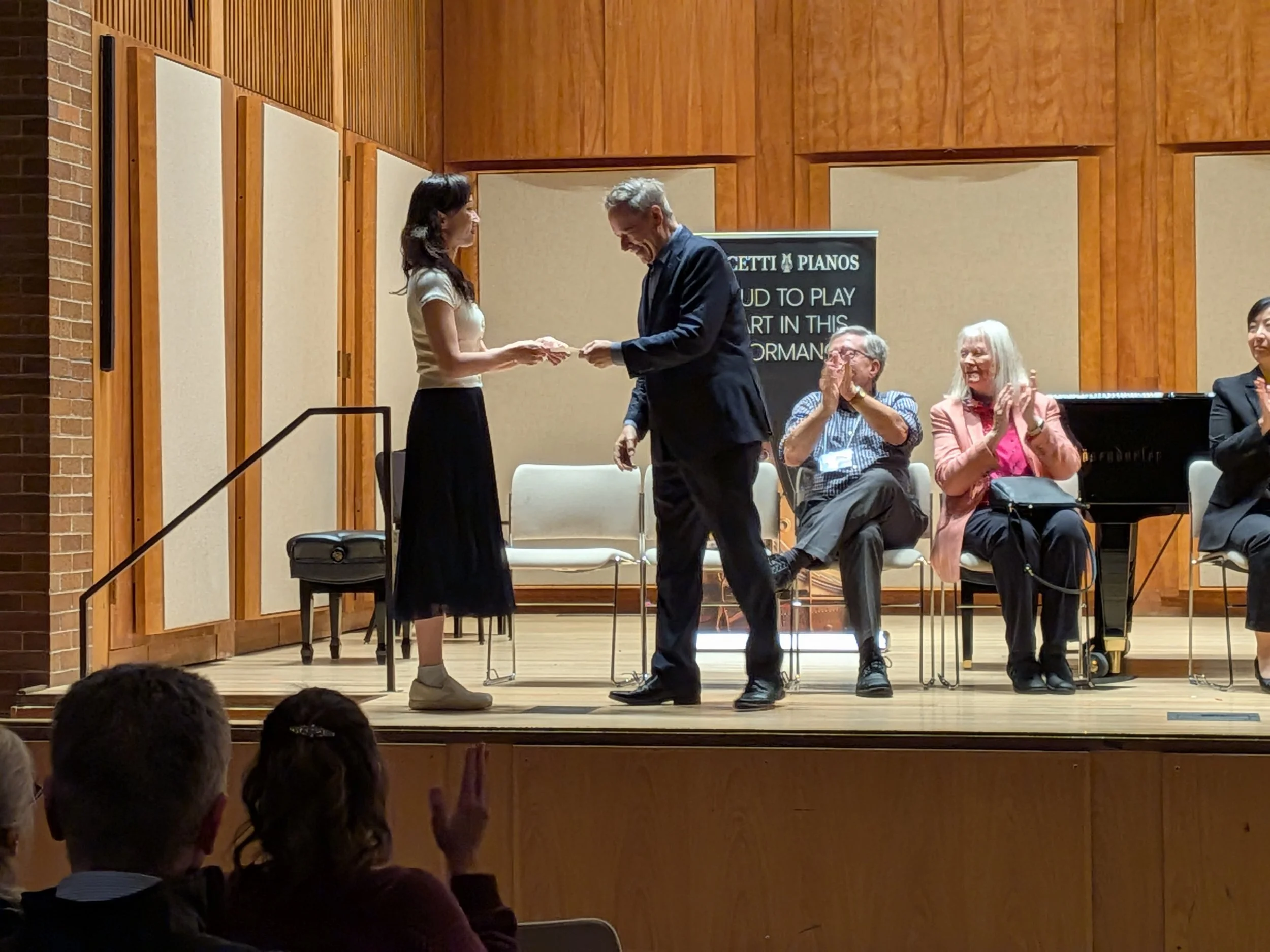 Michael Lewin congratulates Jia Luo on her first place Silver prize