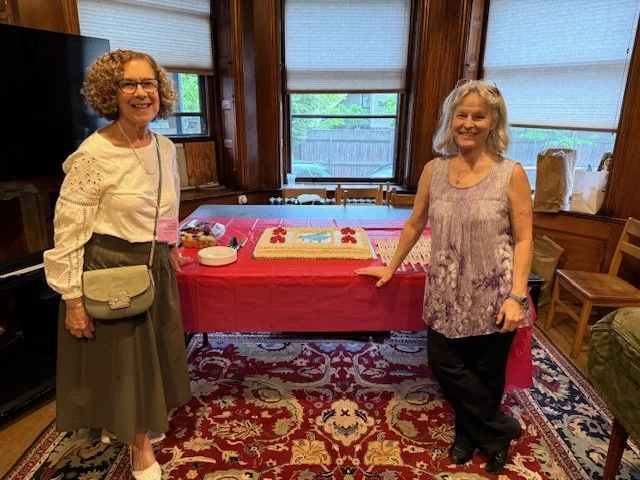 Debee Slater and Sarah Smyth arrange the BIG cake