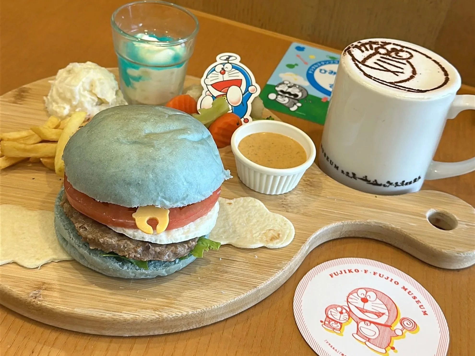 A hamburger meal designed to look like Doremon, the blue Japanese anime character.