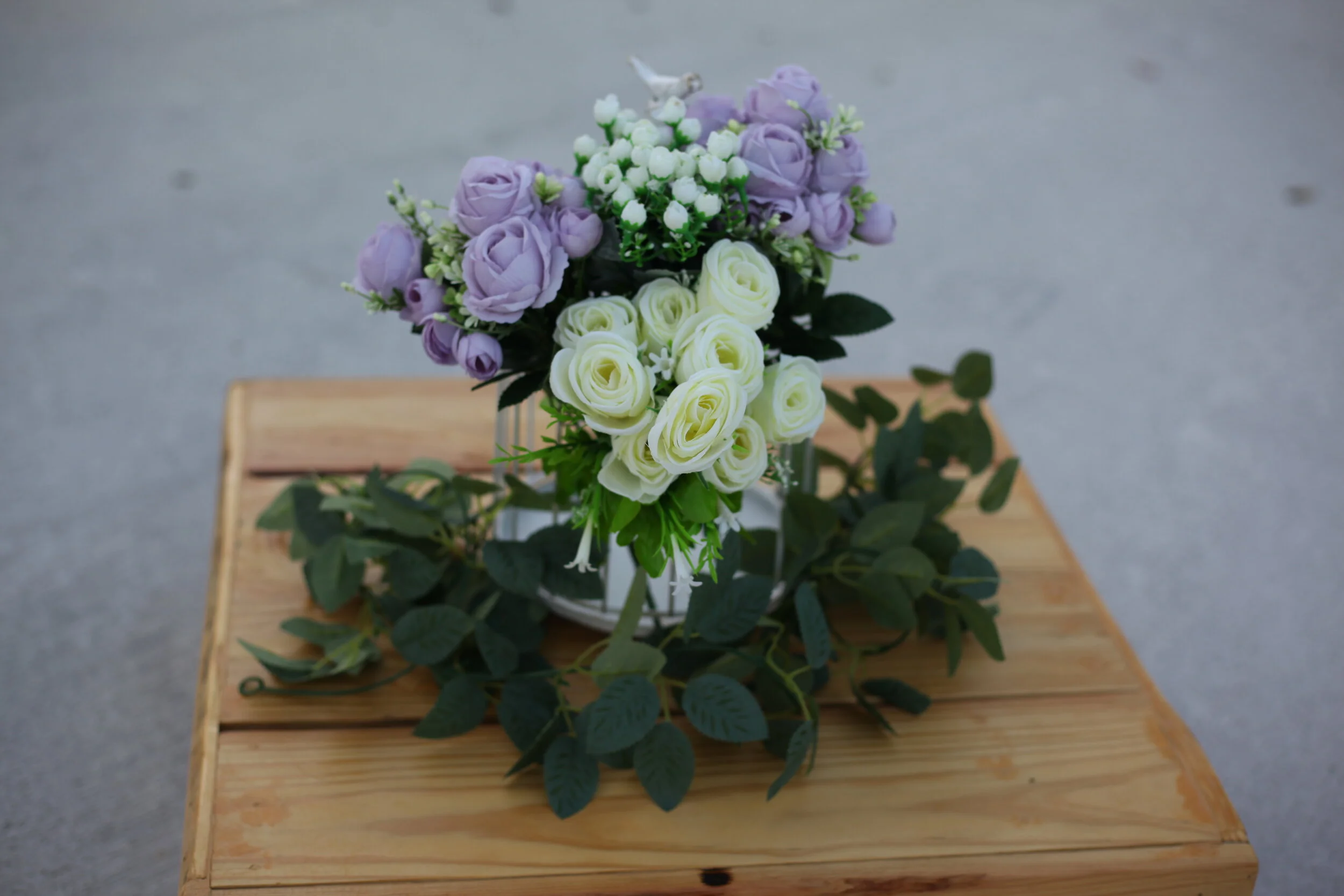 Floral covered birdcage