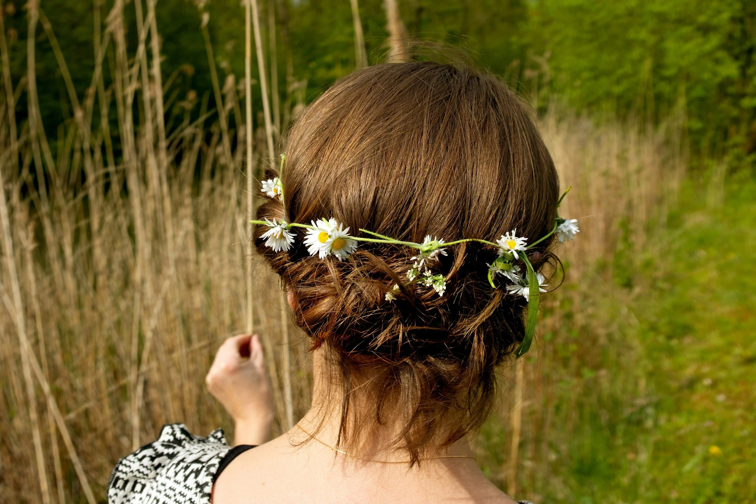 A fresh flower crown woven from many women's shared blooms