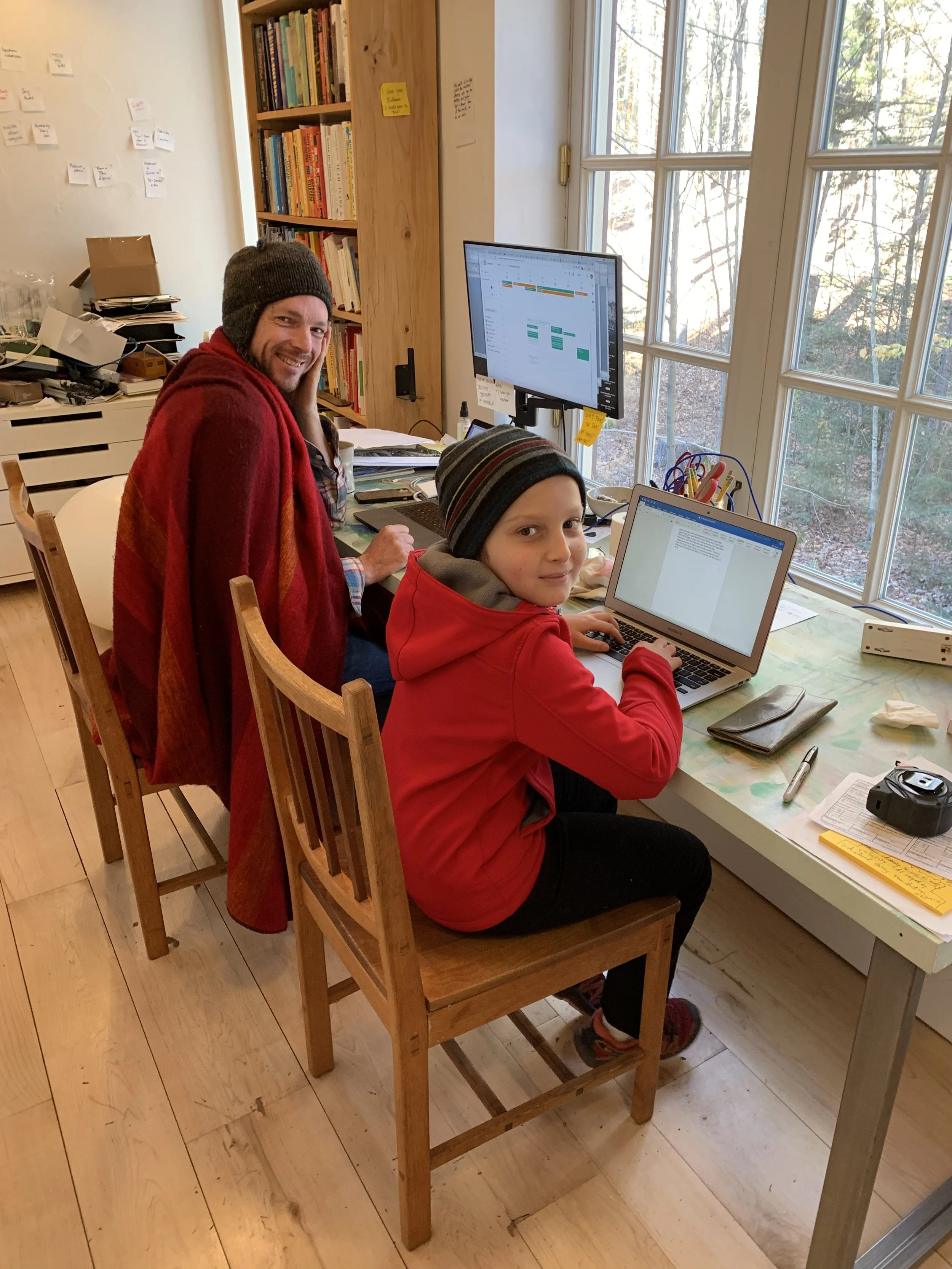 Tristan and Felix hard at work in the office