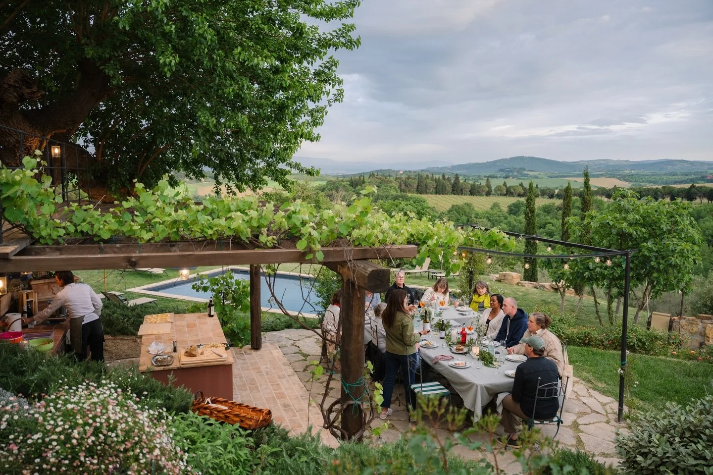 Our outdoor kitchen is one of the places where summer at Poggio Belvedere feels its best. Cooking in the open air, ingredients spread out on the counter, a gentle breeze &mdash; and that jaw-dropping view over the Umbrian hills that still stops us ev