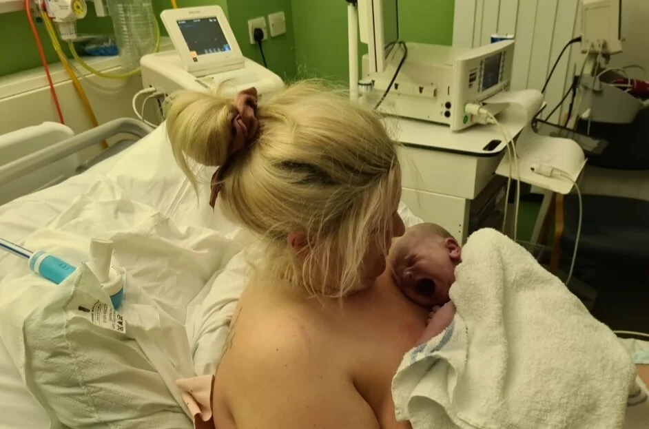 Mum holding newborn baby.jpeg