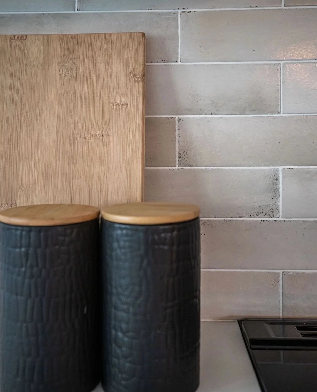 GREY GROUT for Kitchen or Bathrooms 
 
This is a great idea for balancing style and upkeep. Grey grout will enhance the pattern of the tile, have less risk of staining and will hide dirt and stains.
 
It&rsquo;s beautiful and classic as a grout color