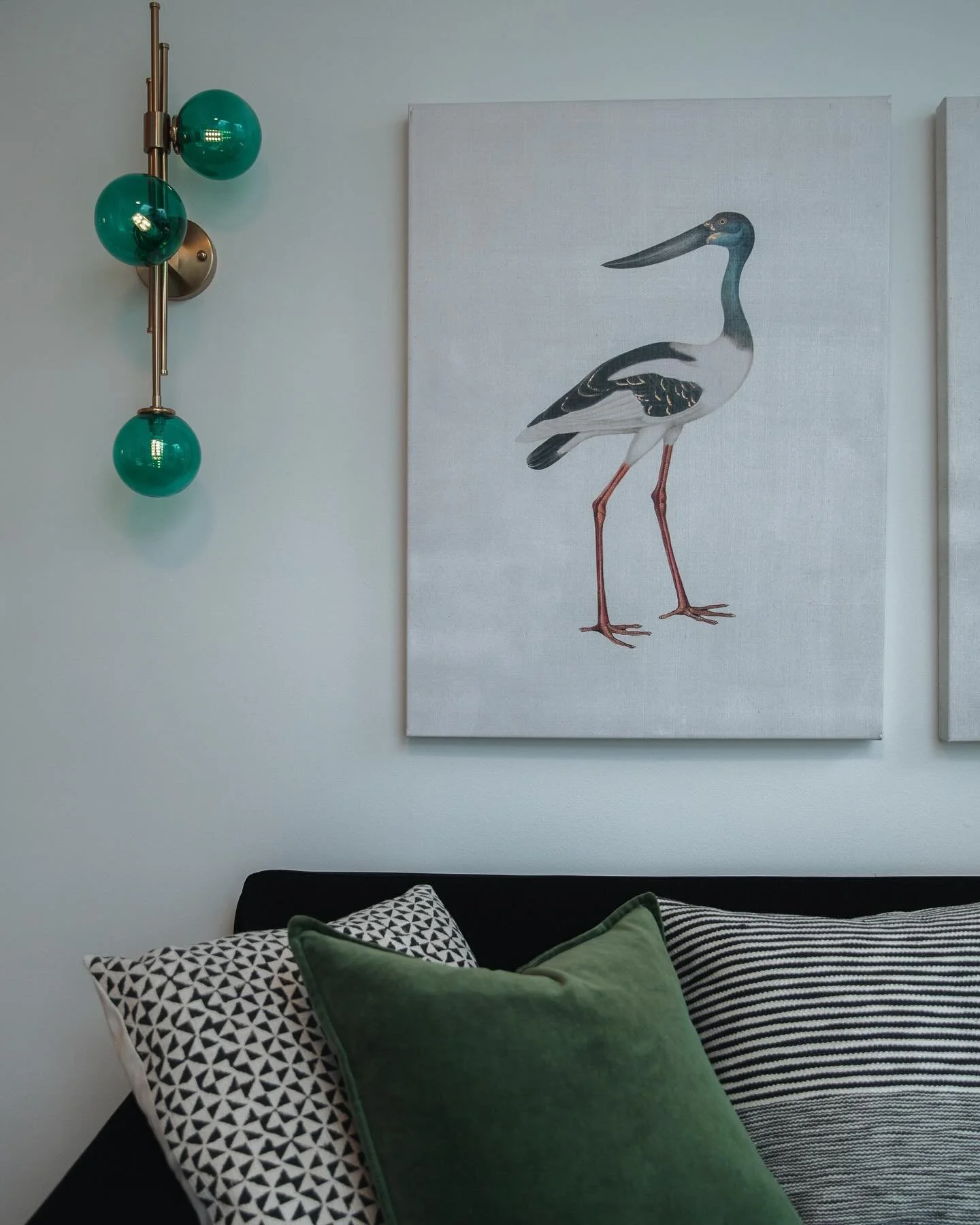 COZY VIBES To make your living room more cozy, add soft textures with throw blankets and pillows, use warm lighting like lamps and fairy lights, incorporate natural elements like plants or wood, choose warm, inviting colors, and arrange furniture to 