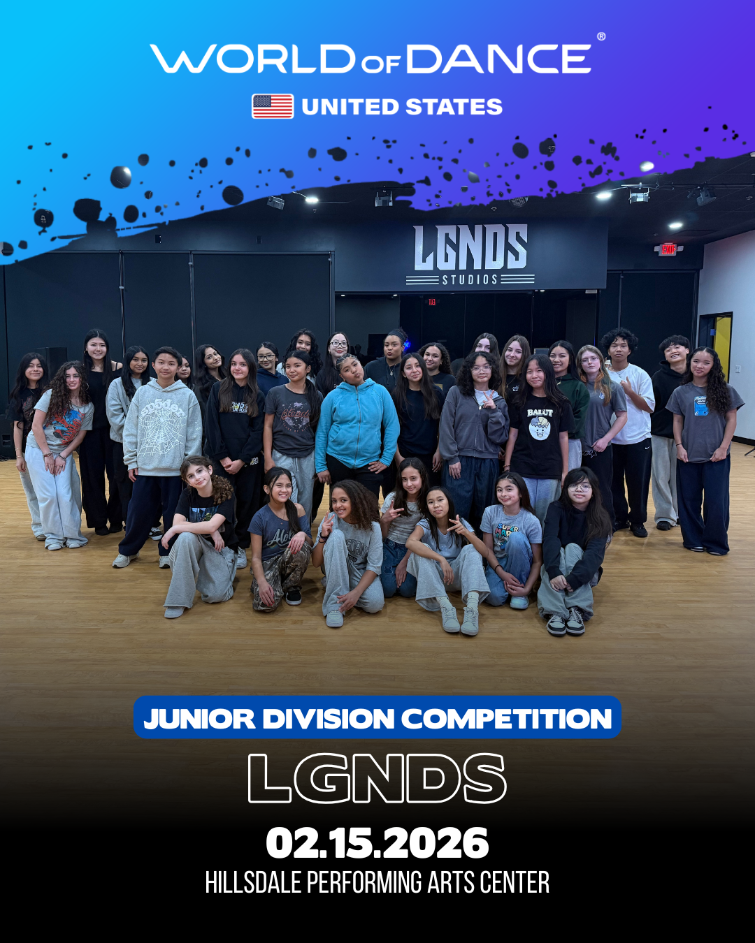 Group of young girls and boys posing in the Hillsdale Performing Arts Center for a Junior Division competition at LGNDS on February 15, 2026, with a banner for LGNDS Studios in the background.