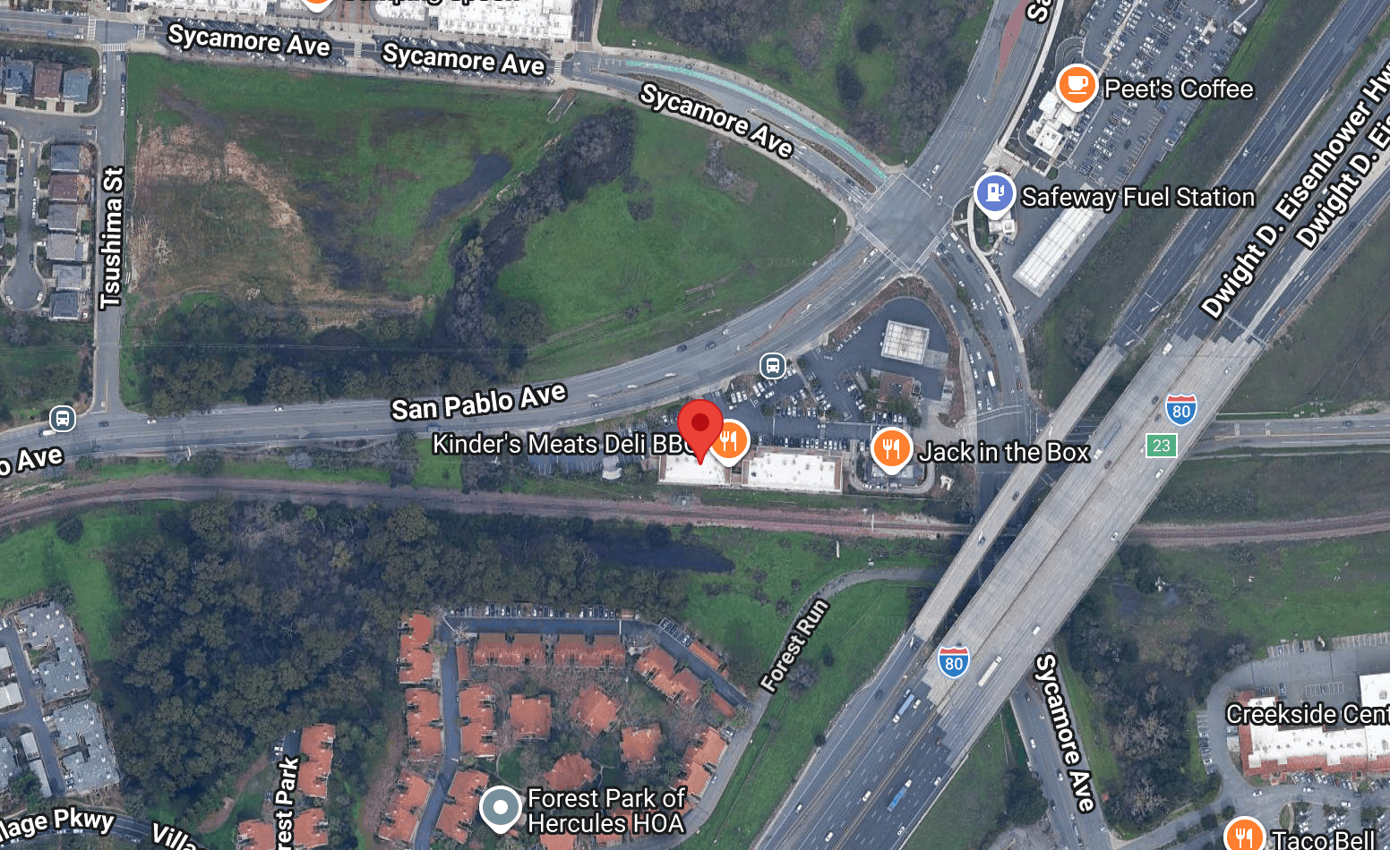 Satellite map showing a stretch of Sycamore Avenue, San Pablo Avenue, and nearby streets with icons indicating restaurants, a gas station, a coffee shop, and a residential area.