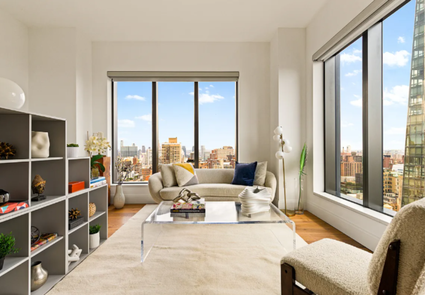 Rose Hill one-bedroom condo living room with soaring ceilings and oak floors in Manhattan