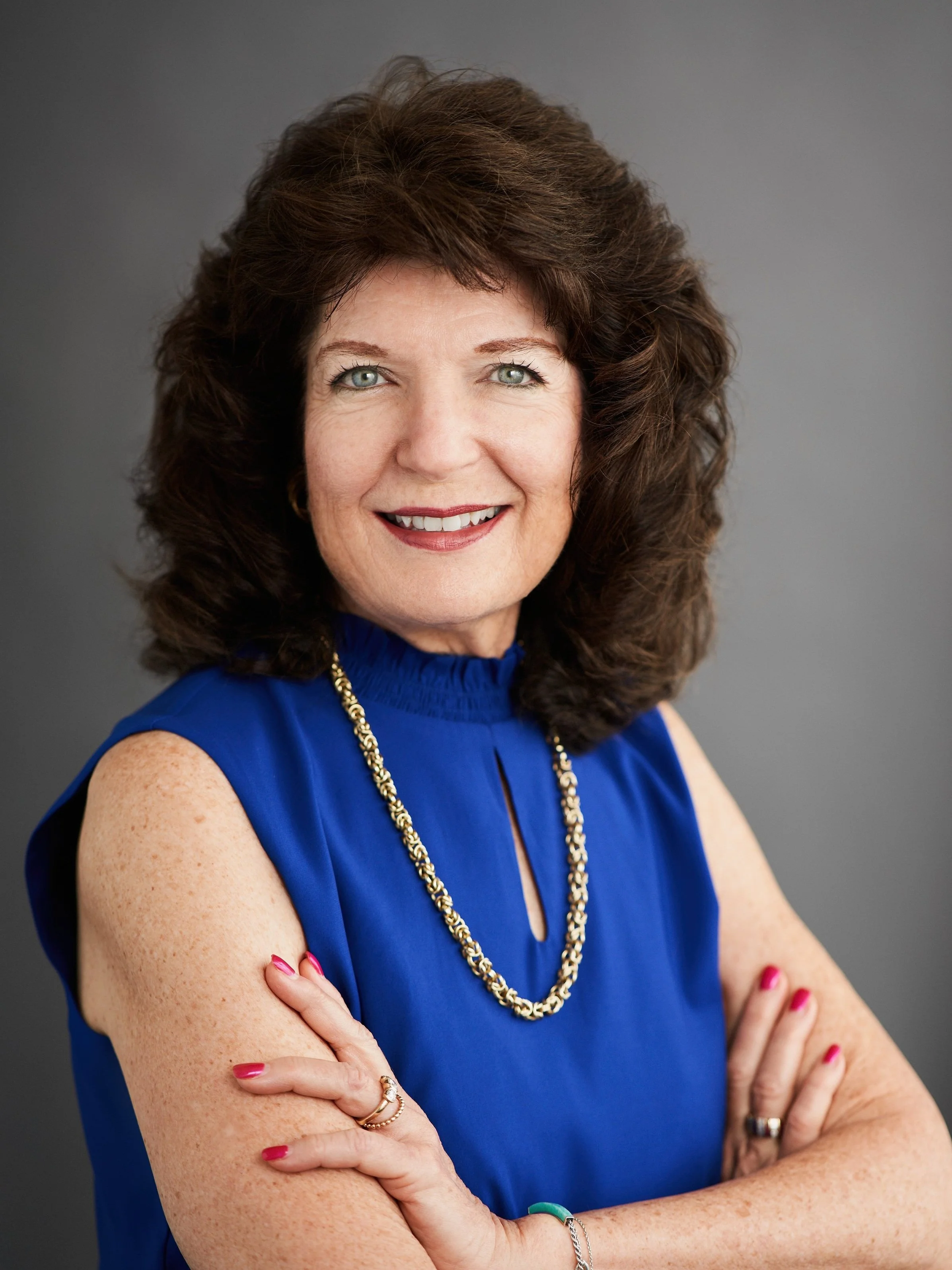 Executive headshot of senior female business leader for corporate website and professional branding