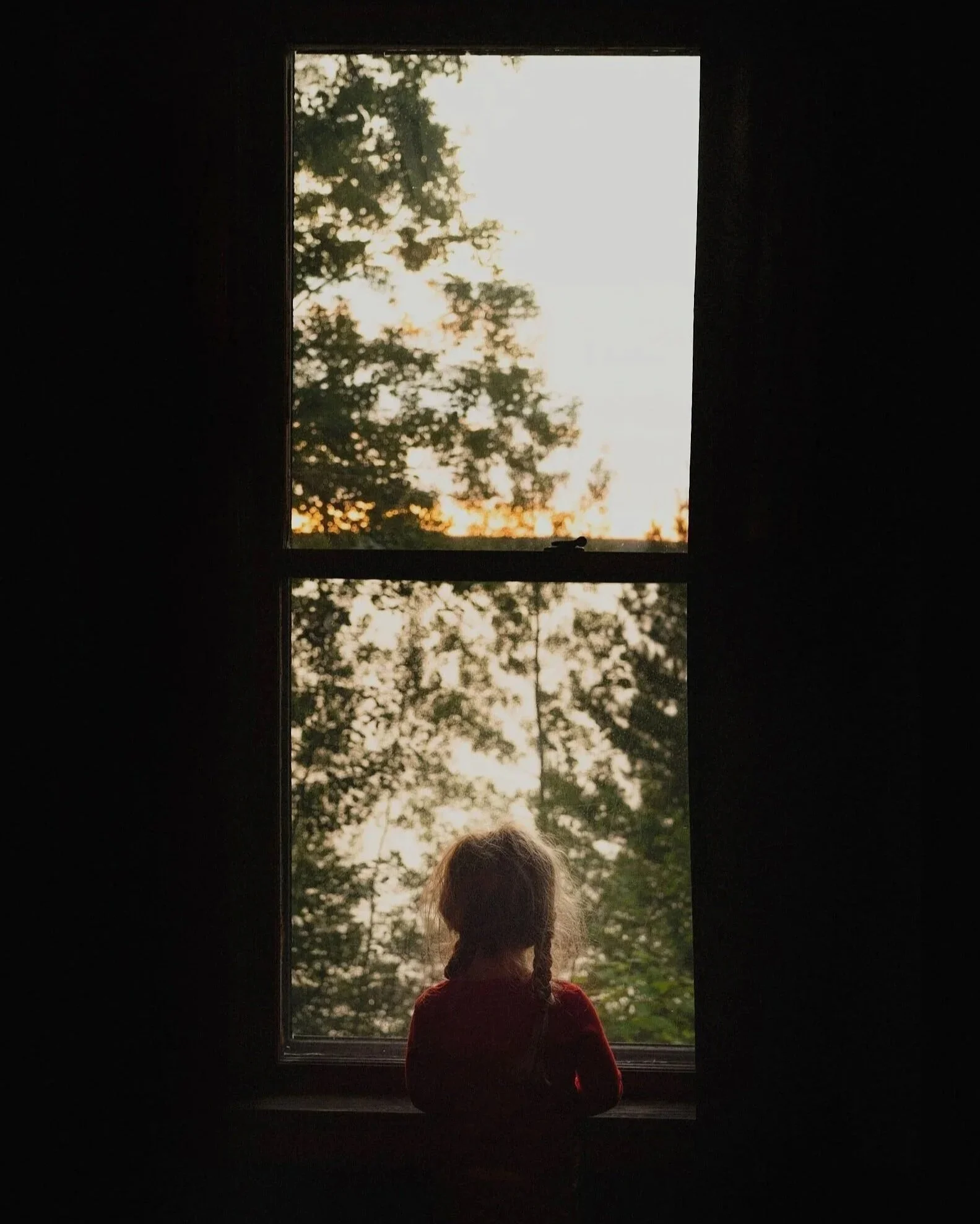 Girl-looking-out-window.jpg