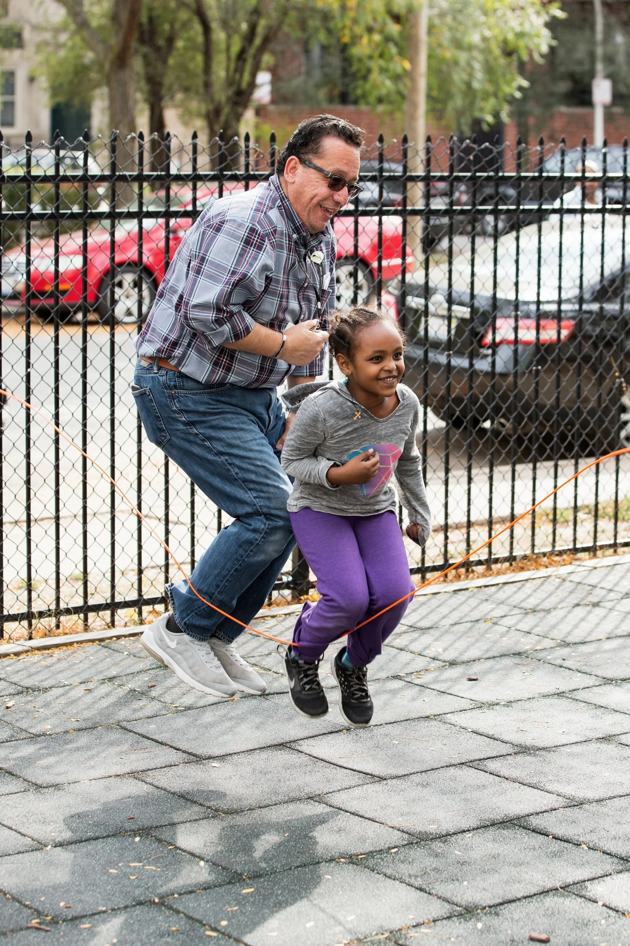 Community educator supporting students with technology access as part of a nonprofit academic enrichment program.