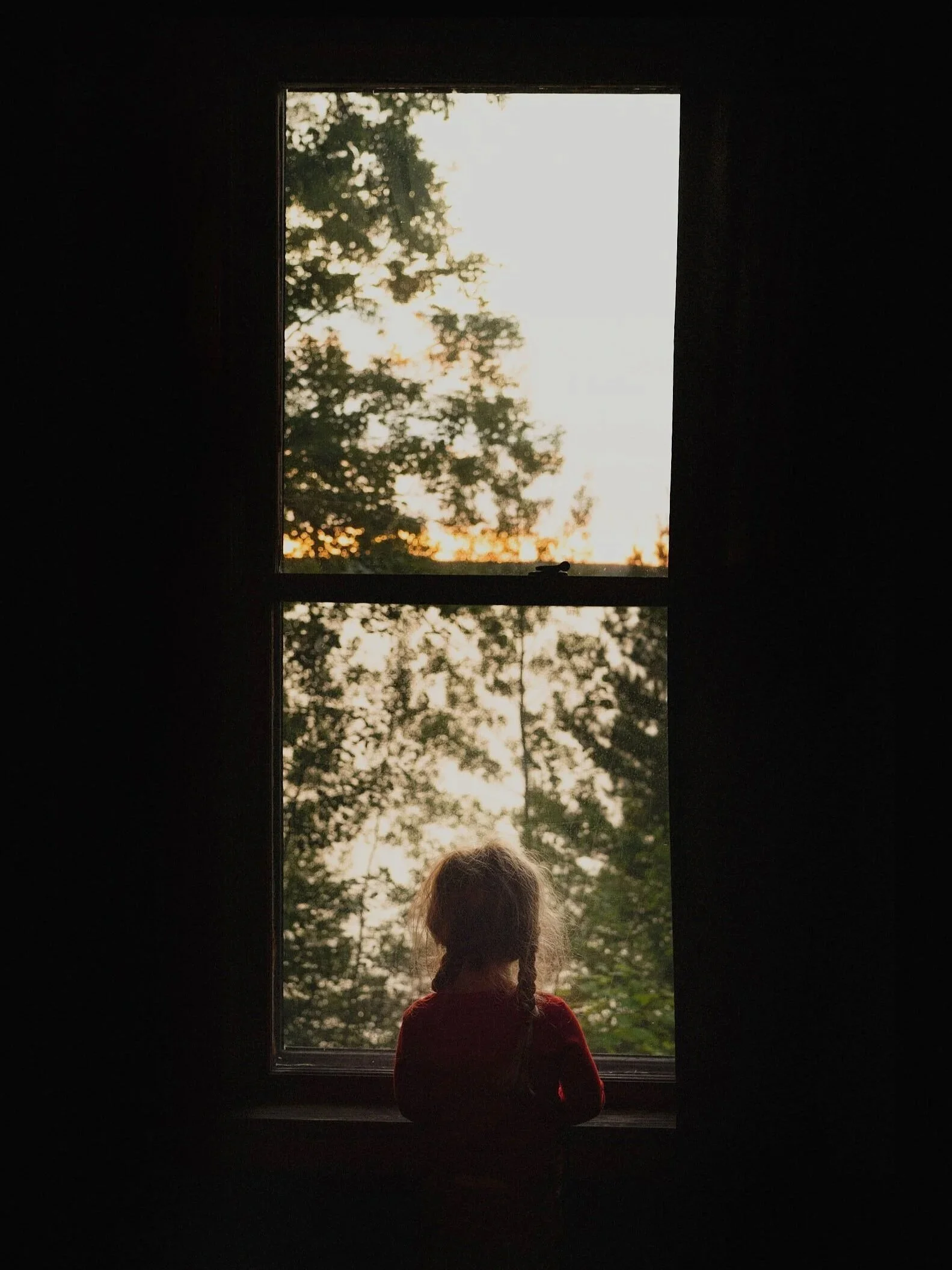 Girl-looking-out-window.jpg