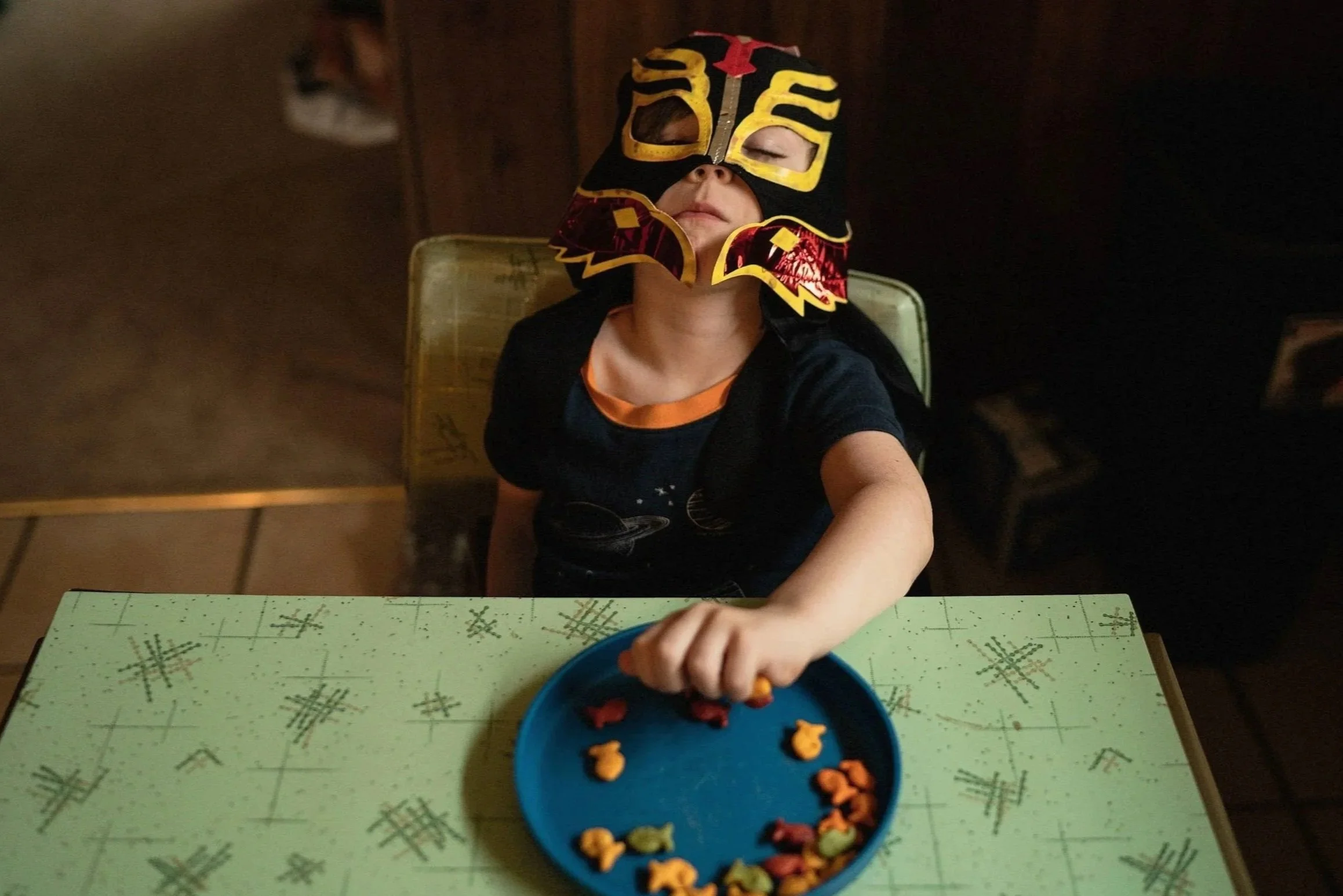this-is-home-04-masked-child-table.jpg
