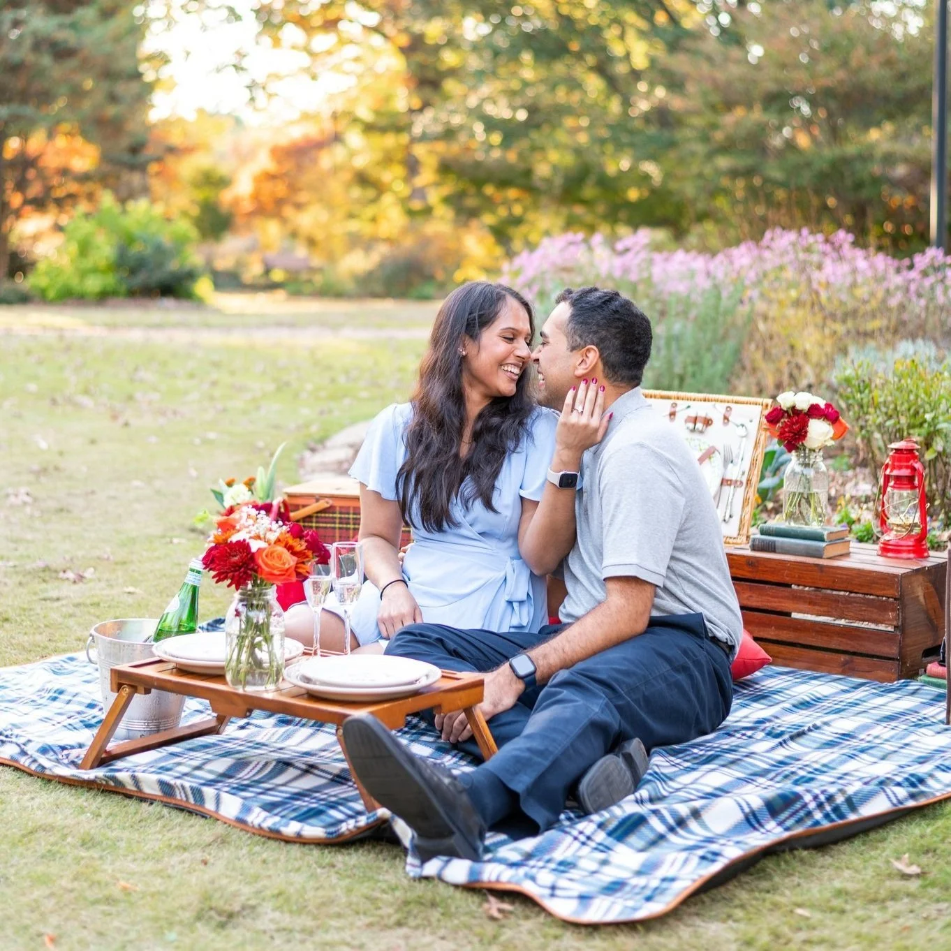 Couple laughing at a picnic