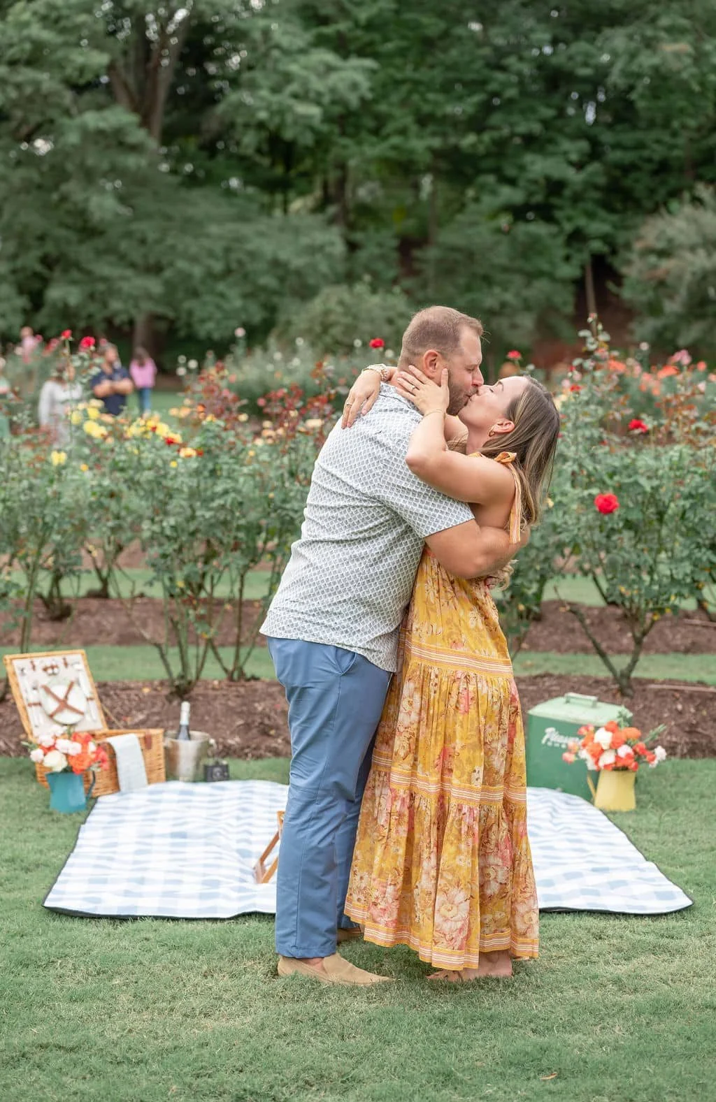 Newly engaged couple kissing after man proposed