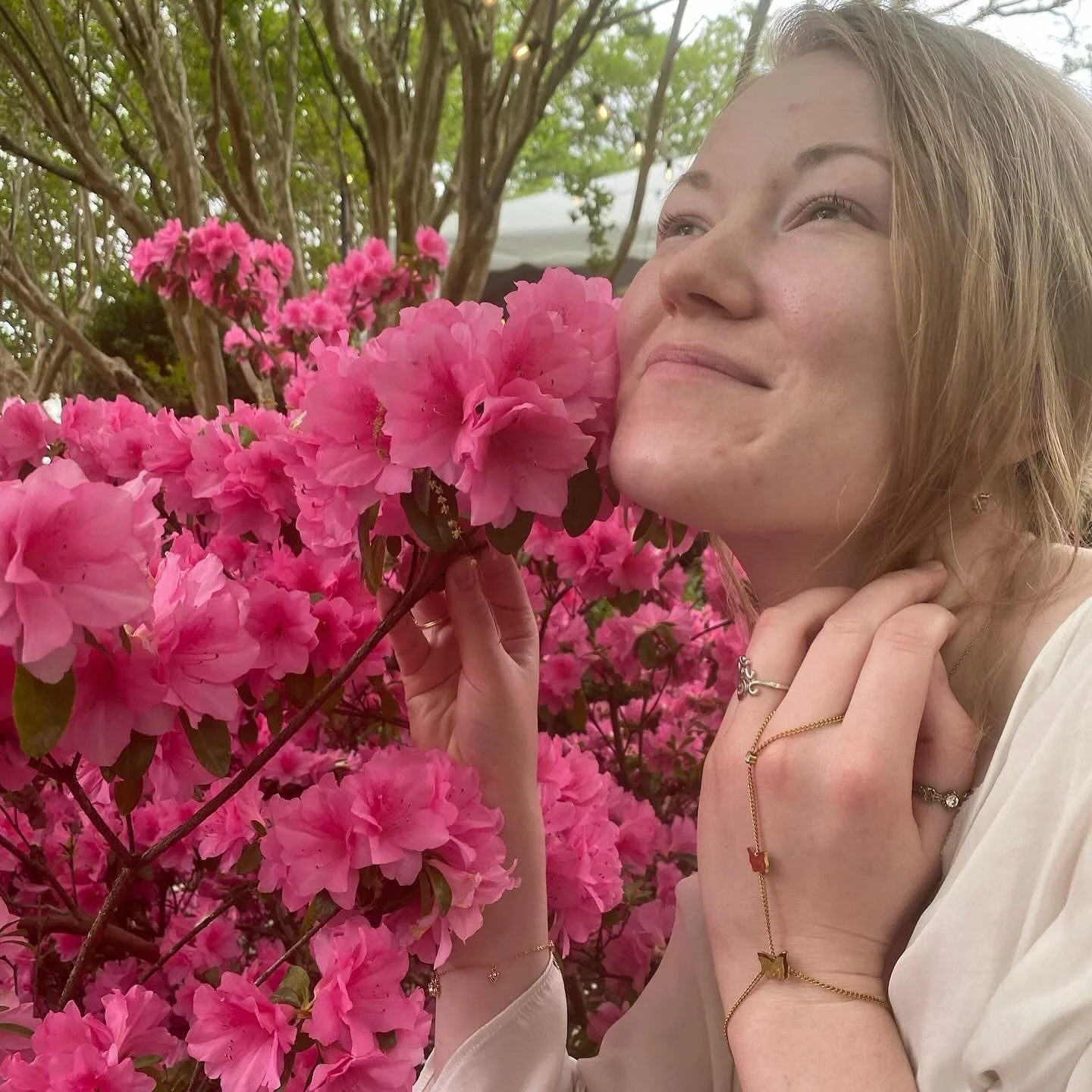 Kenna King near an azalea bush