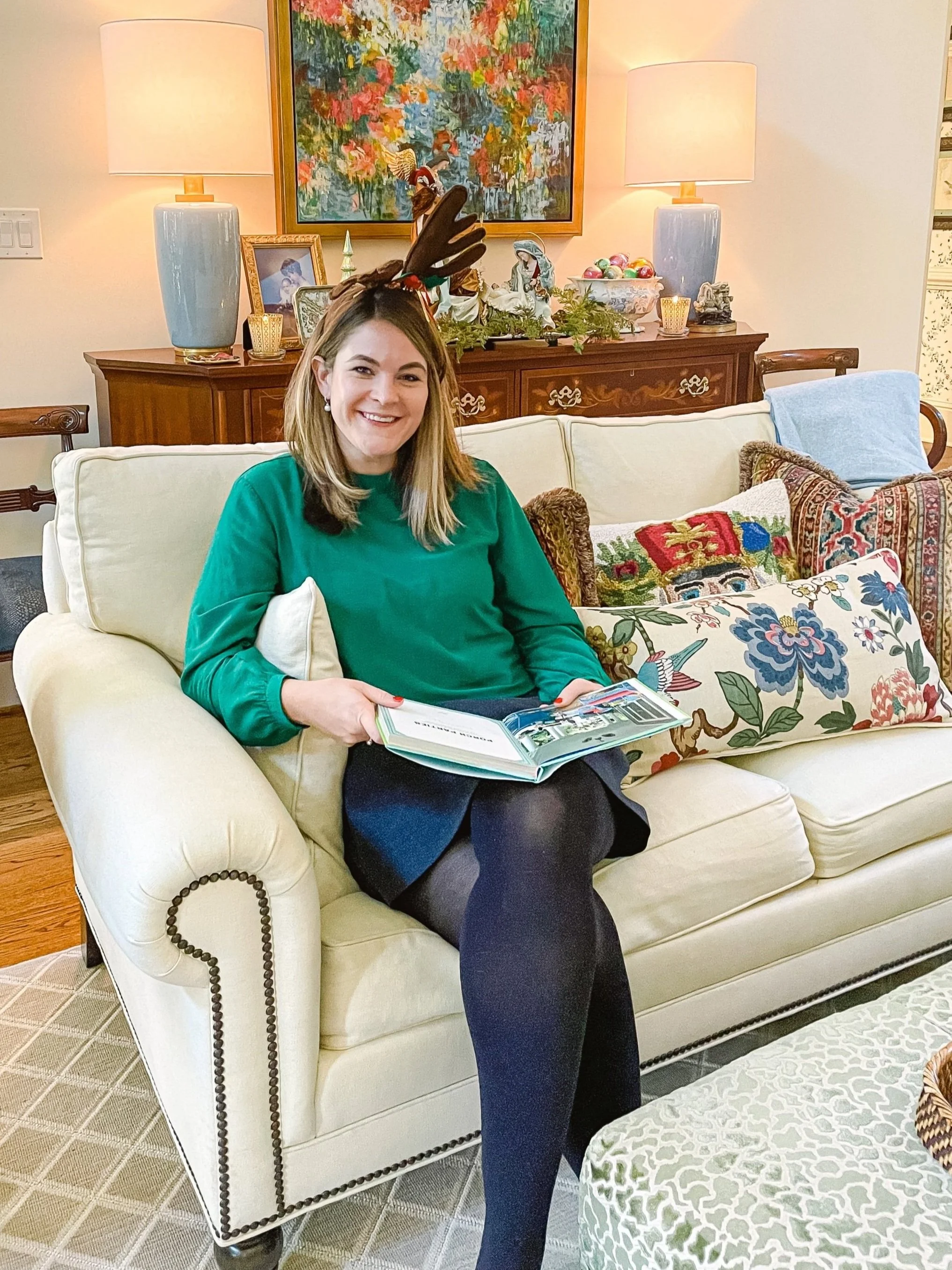 Angela Byrnes, Owner of Southern Picnics, reading an interior decorating book.