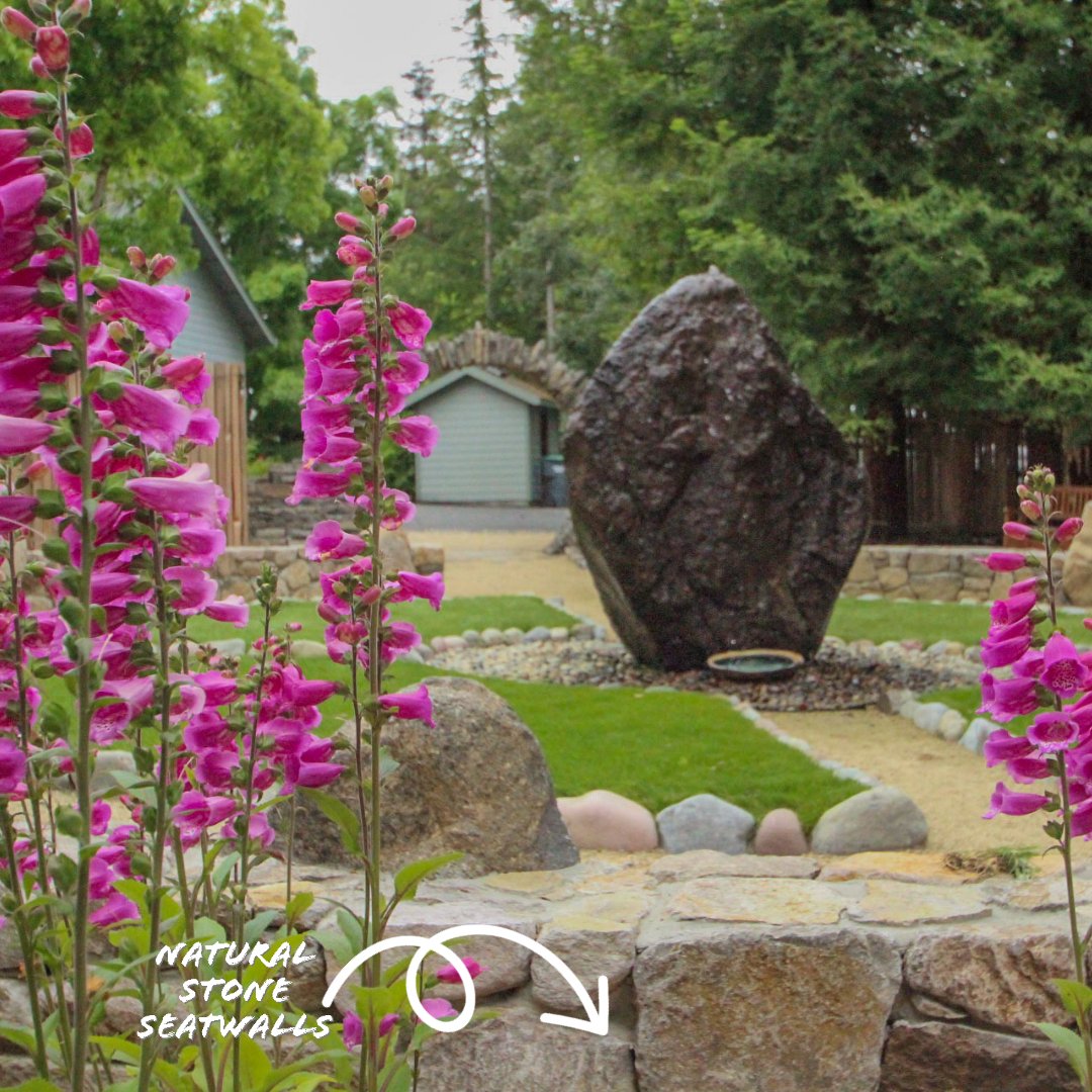 Medicinal garden installed with beautiful stone archway and seat walls, boulder water feature and rain garden.