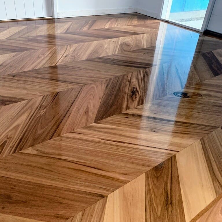 What an entrance!! Custom made Blackbutt chevron parquetry supplied and installed by Timberoo for Grant McDonald Homes. This glossy finish will dry to a Matt sheen to match the prefinished Blackbutt flooring upstairs. #timberoo_flooring_specialist #g