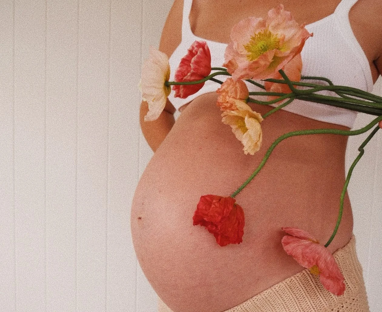 pregnant belly and organic blooms