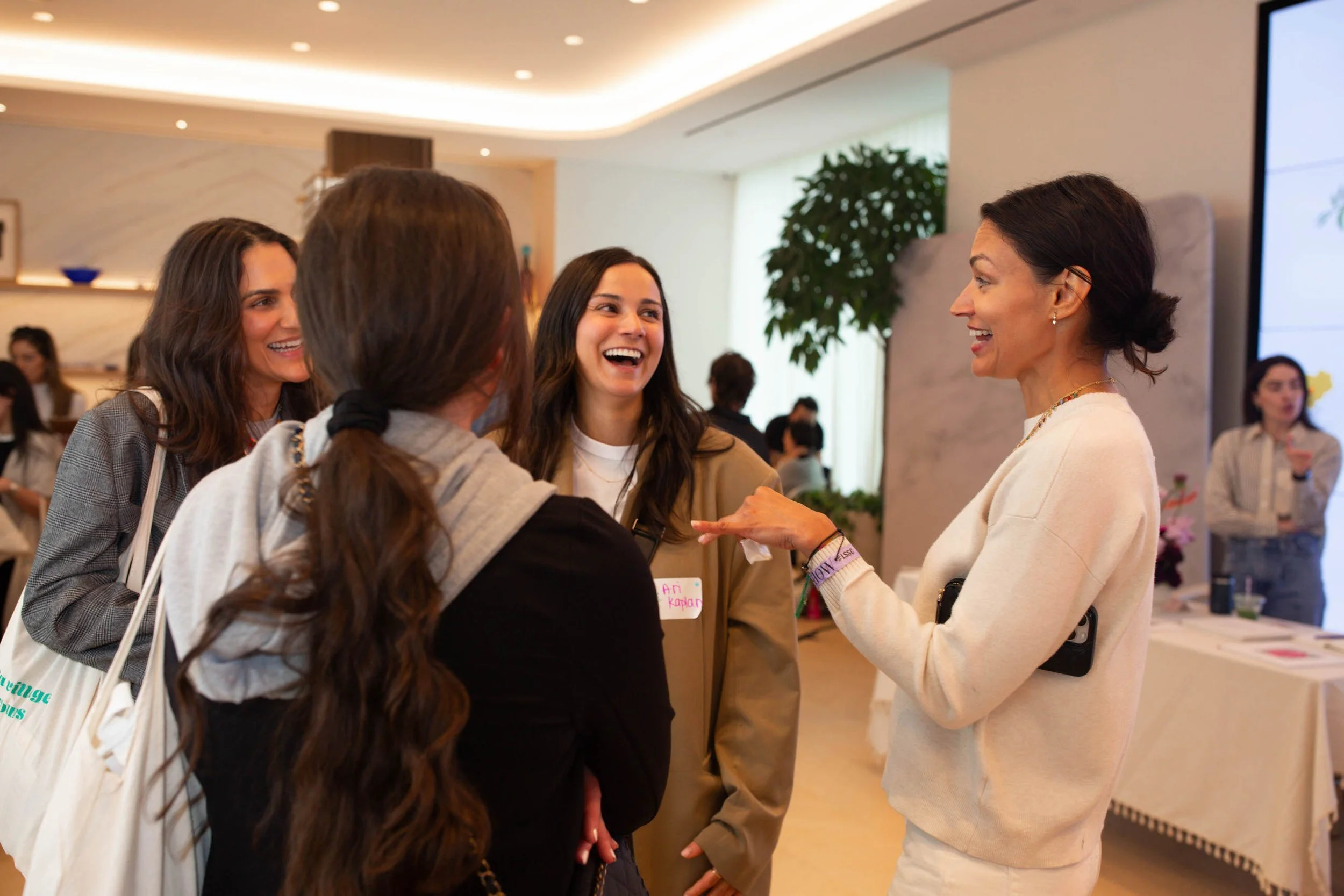 new moms laughing and enjoying conversation mysha mom events