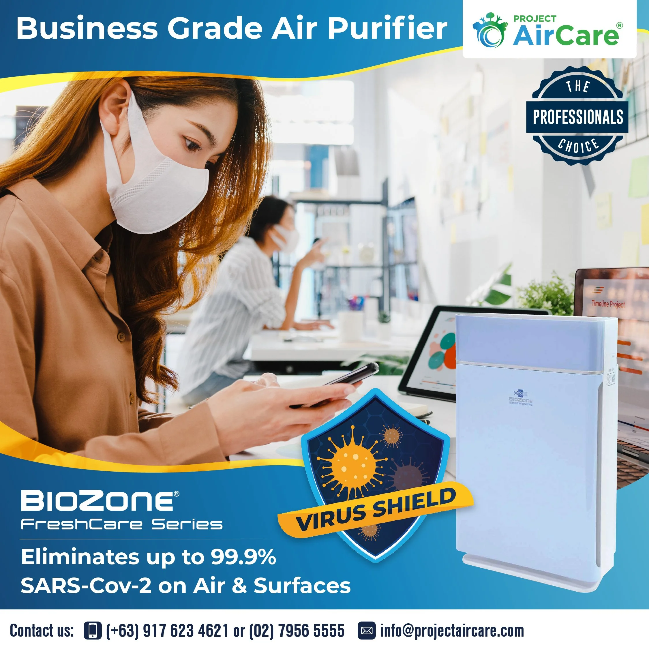 A woman wearing a mask using her phone in an office, with a prominent air purifier labeled 'BioZone' on the desk, promoting virus shield protection for SARS-CoV-2 with a graphic of virus particles and text highlighting 99.9% elimination.