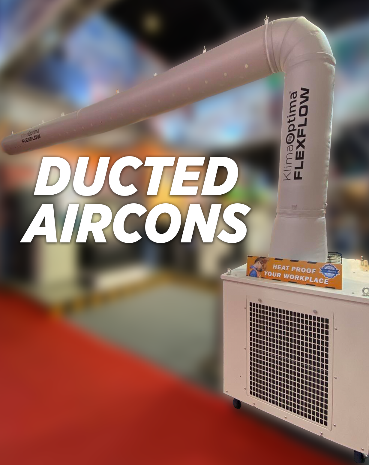 Ducted air conditioning unit with a large flexible duct on top and a sign that says 'Heat Proof Your Workplace' in a warehouse or industrial setting.