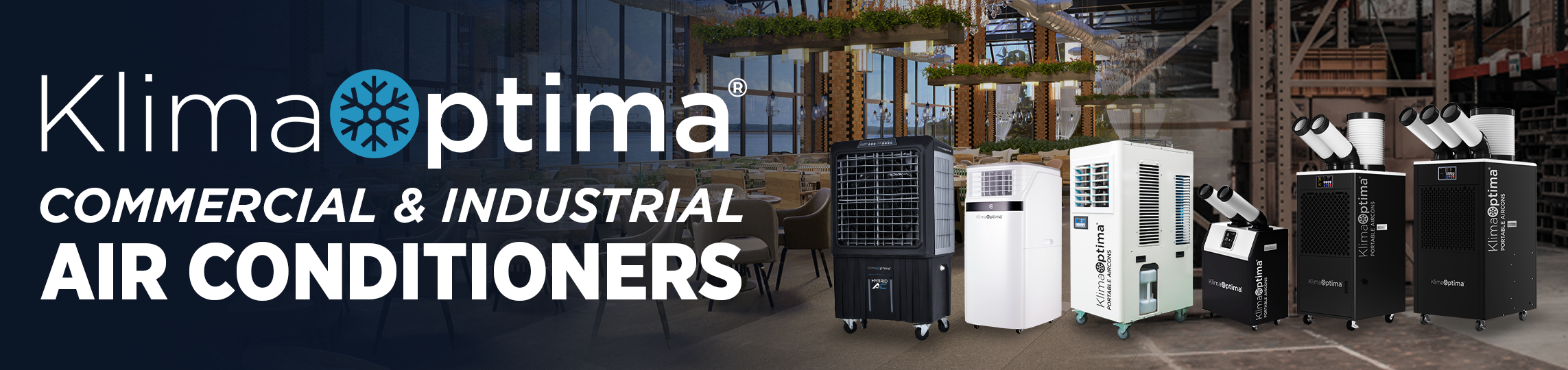 Display of various commercial and industrial air conditioning units in an indoor setting with modern decor and ceiling plants.