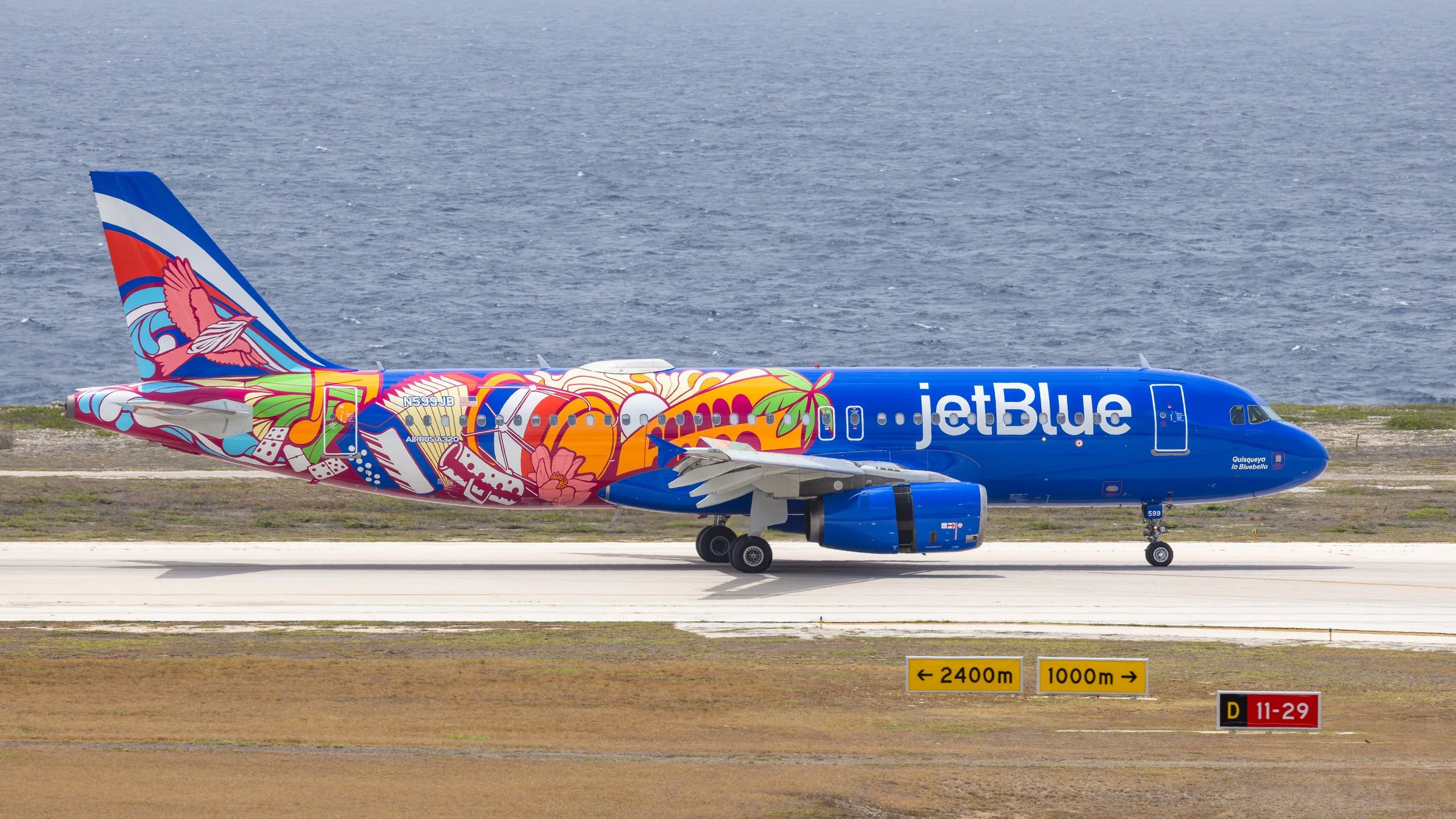 JetBlue Airbus A320-232 N599JB Dominican Republic special livery on runway 11 at Curacao TNCC June 2026