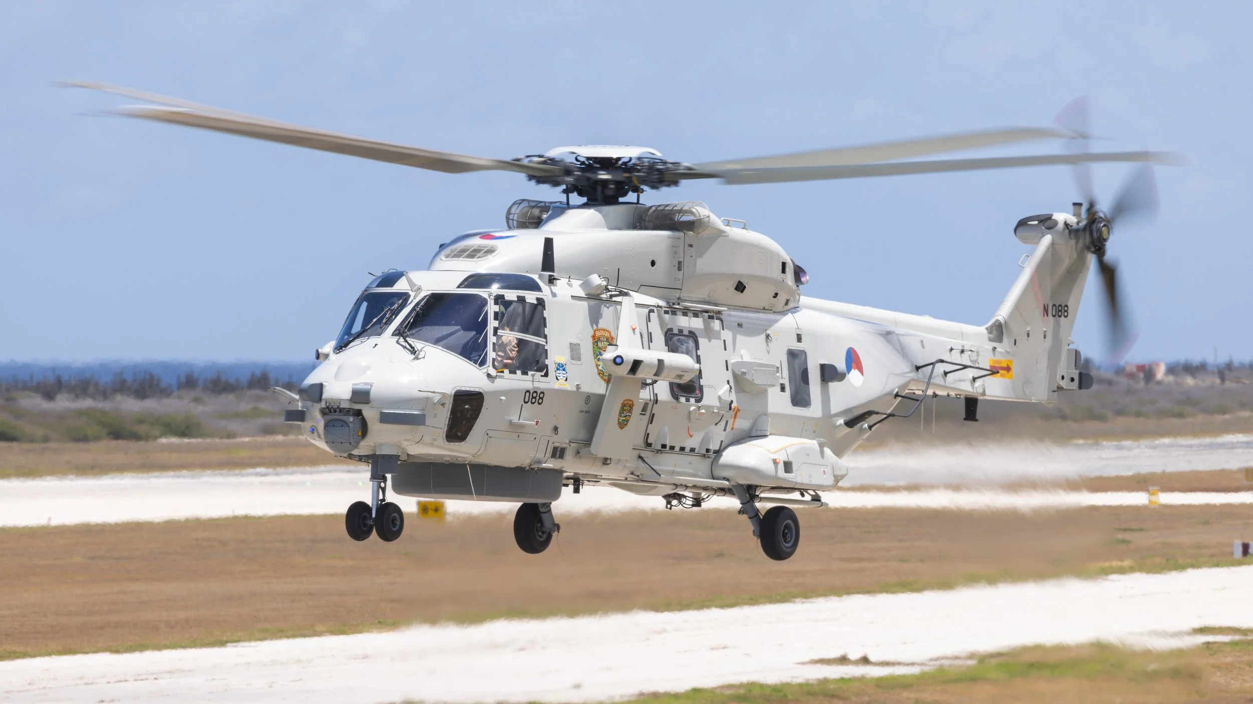 Royal Netherlands navy 860 squadron NH-90 hovering over the taxiway at Curacao TNCC