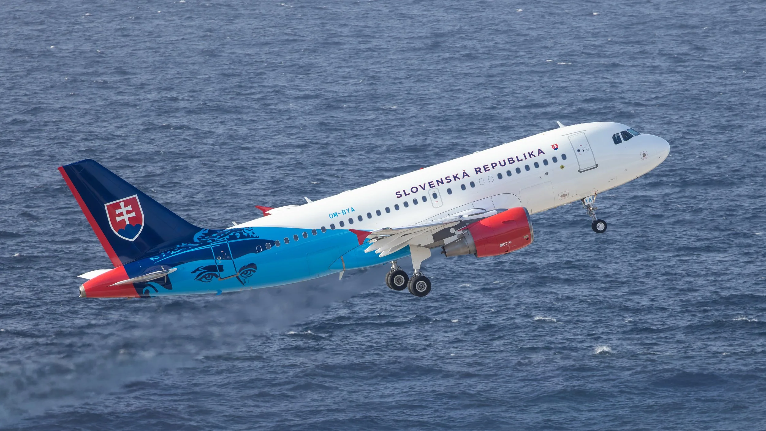 Slovakia Government Airbus A319-115(CJ) OM-BYA departs Curacao TNCC June 29 2026 with the blue Caribbean Sea in the background
