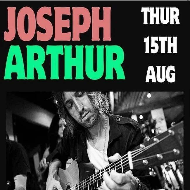 Poster advertising a concert by Joseph Arthur on Thursday, August 15th, featuring a black and white photo of Joseph Arthur playing an acoustic guitar.