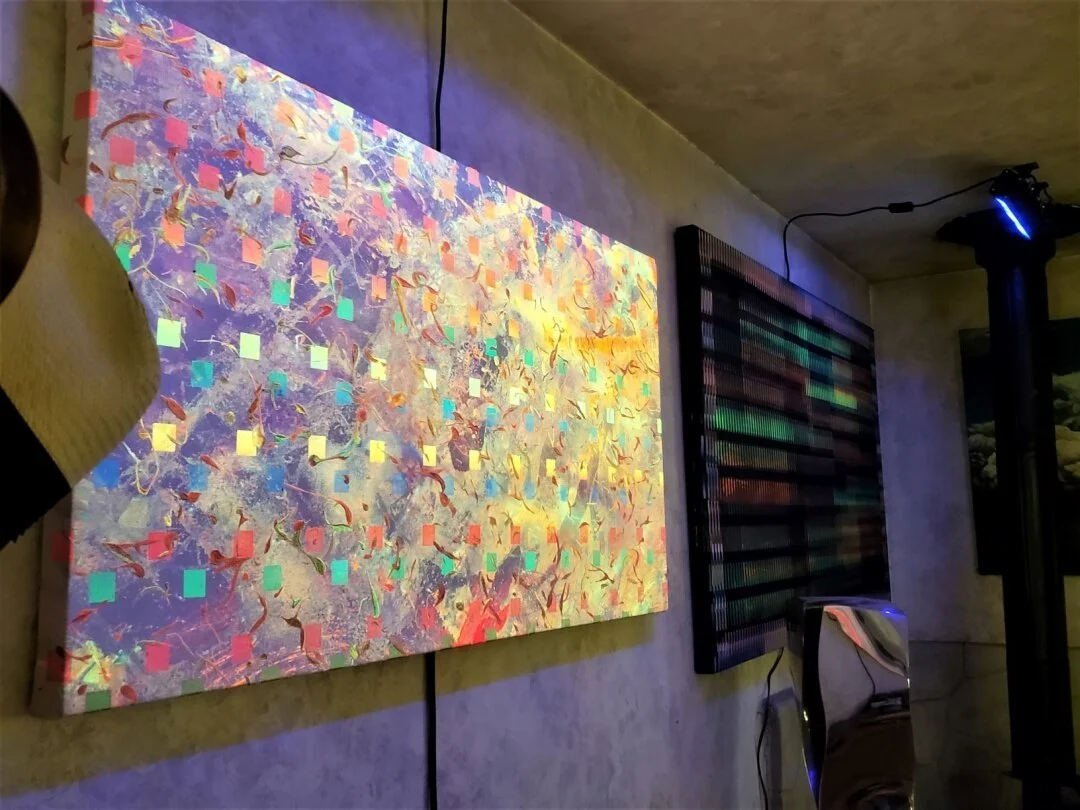 I decided to hang a couple of the new UV/Glass pieces I had in the recent show in New Hope.  The first three images are with UV lighting. The fourth image is when UV light is turned off and the phosphorous pigments under the UV inks appear to glow. T