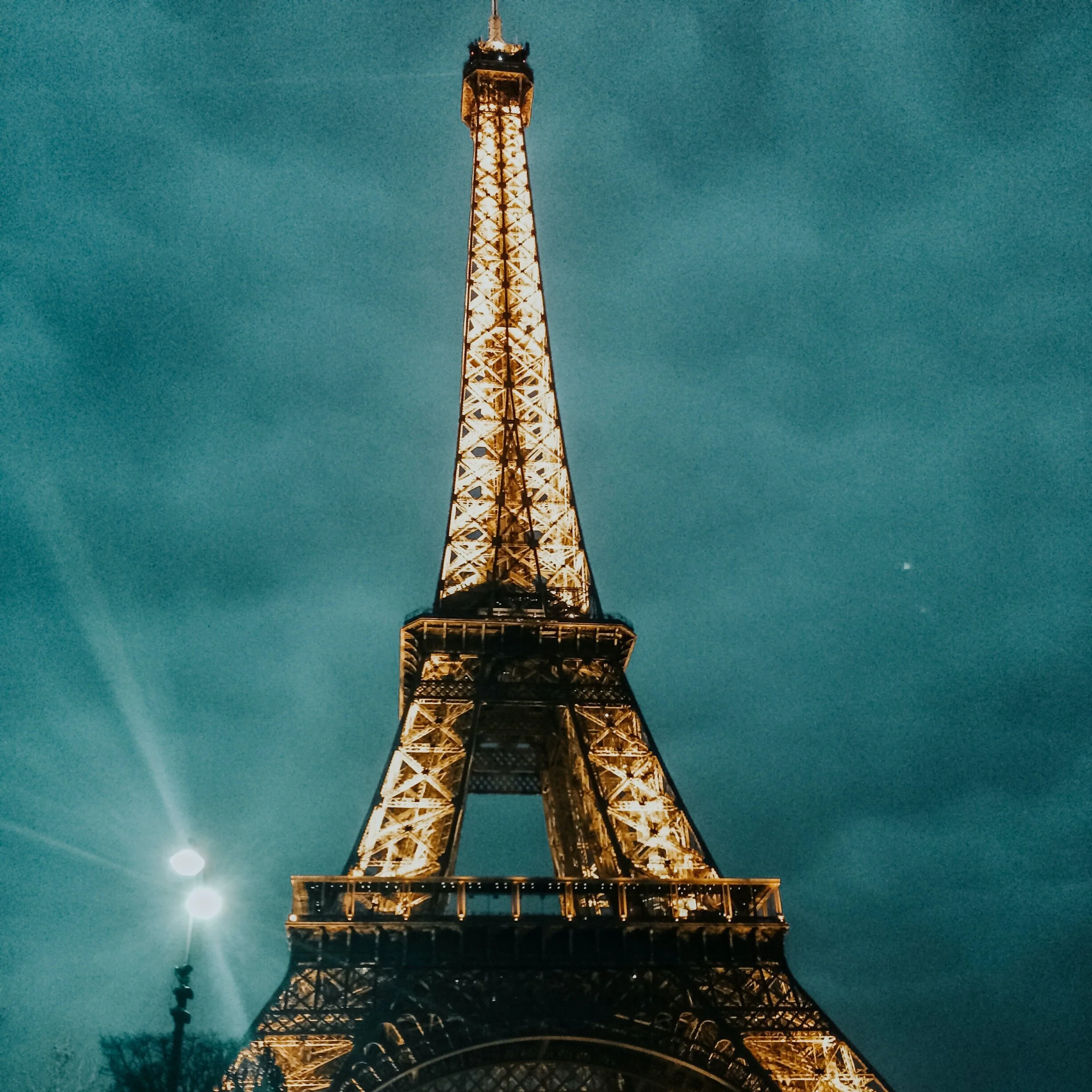 Eiffel tower lit up at night