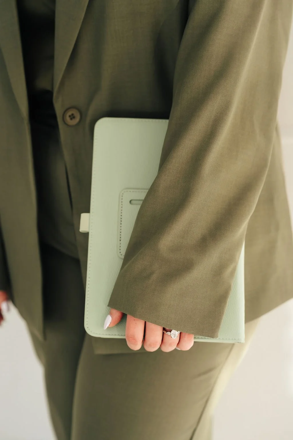 Detail shot of person holding a tablet